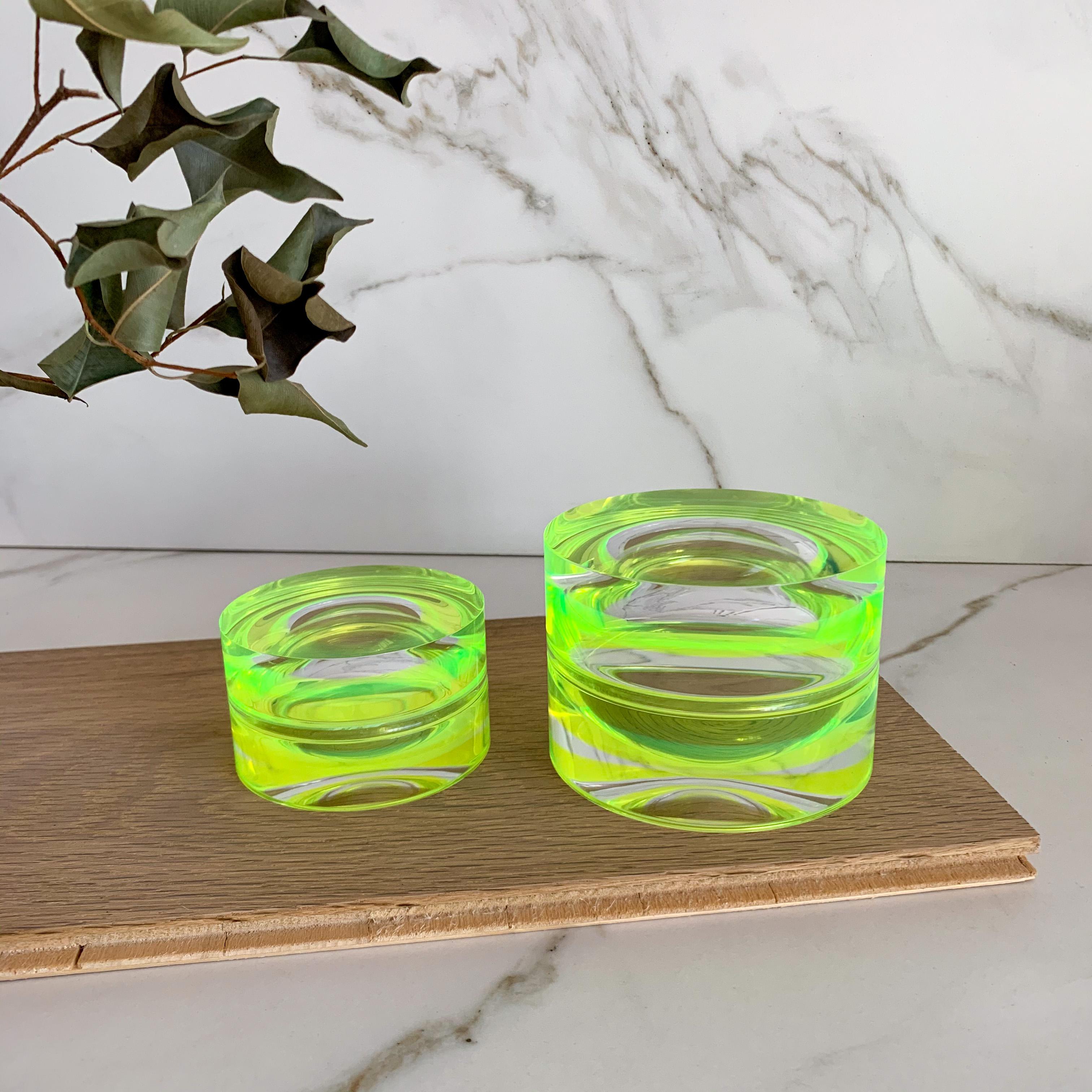 Modern, colorful and fun round box that can be used as a decorative element on a coffee table, desk or nightstand. Serving double duty as a storage box or as a candy bowl. 
They look beautiful when you pair the two available sizes.

Material: