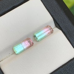Tormalina naturale bicolore verde neon e rosa pesca, coppia di gemme sciolte 3,02 carati