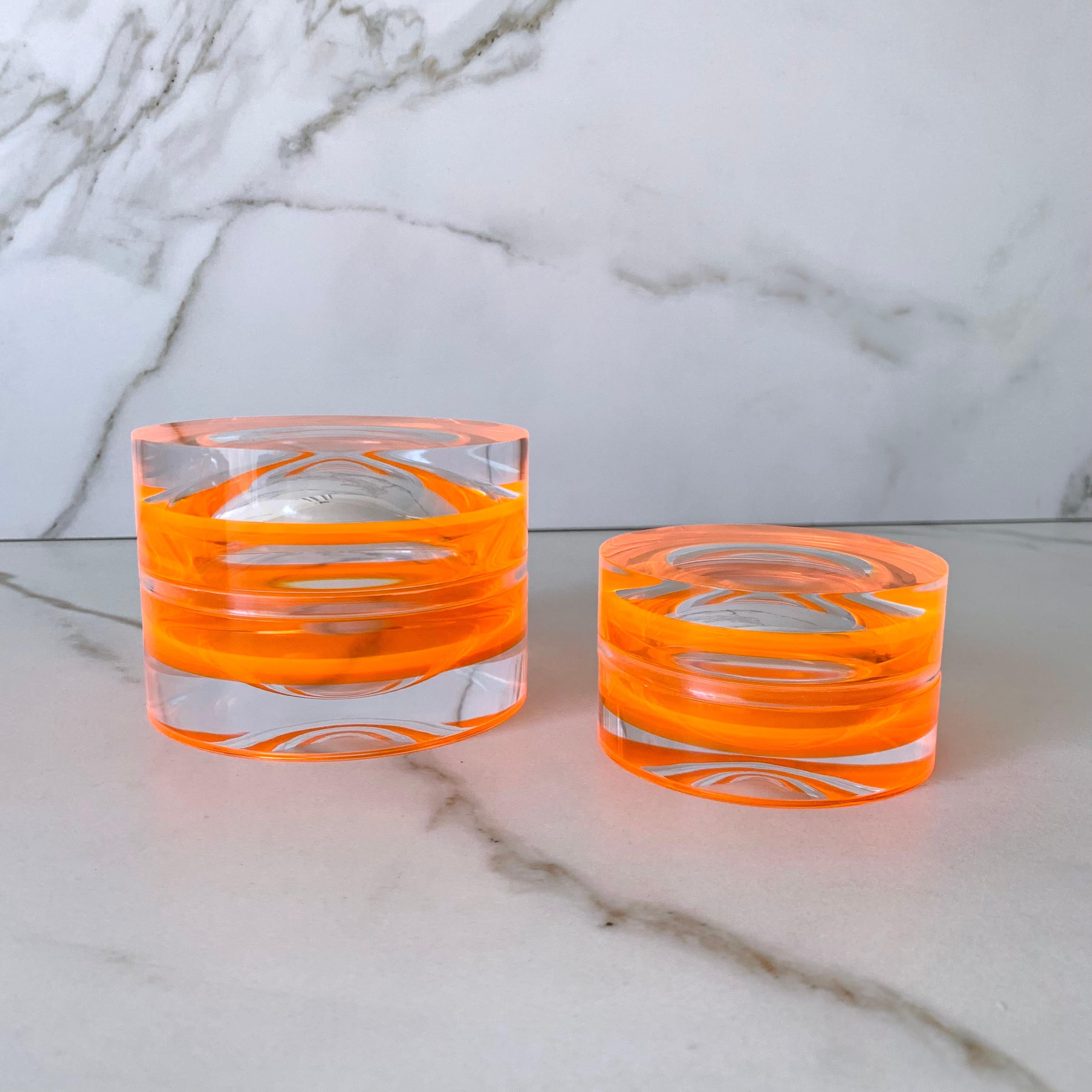 Modern, colorful and fun round box that can be used as a decorative element on a coffee table, desk or nightstand. Serving double duty as a storage box or as a candy bowl. 
They look beautiful when you pair the two available sizes.

Material: