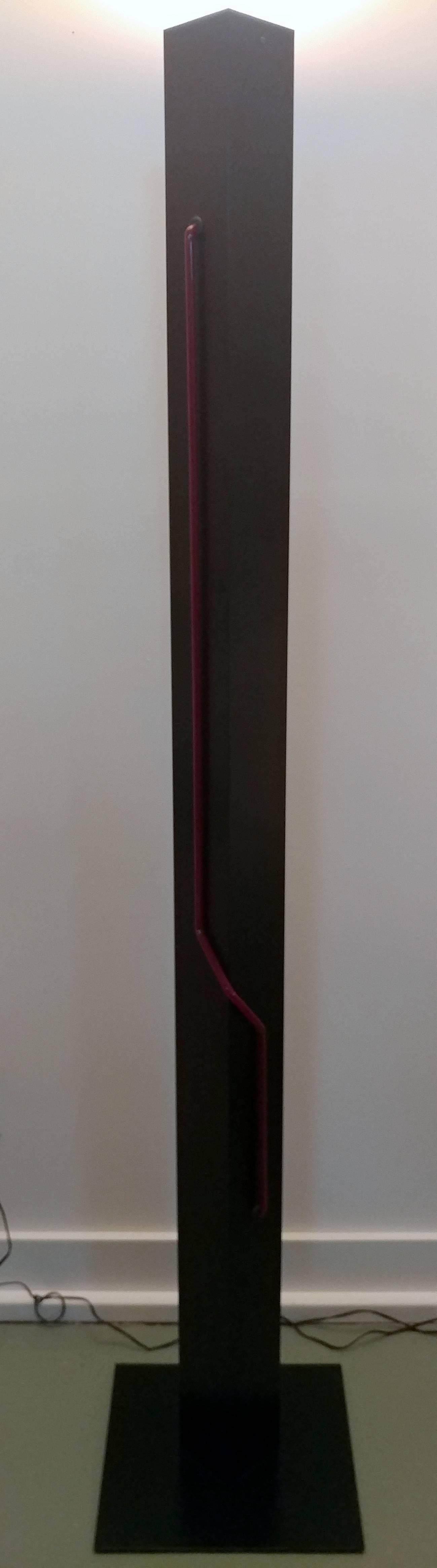 A series from Let There Be Neon by artist Rudi Stern created during late 1970s. A Torchiere up light with dimmer in black power-coated body, red neon tube light in separate on-off switch. Functionality and statement art piece either on or off. Two