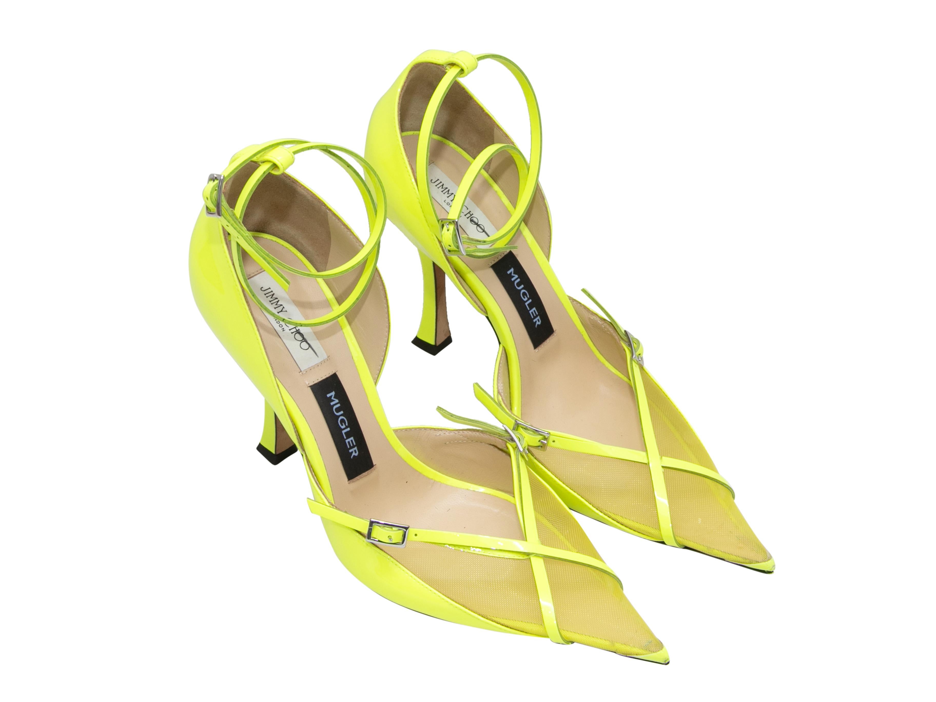 Neon yellow leather and mesh pointed-toe pumps by Mugler x Jimmy Choo. Silver-tone buckle accents at tops. Buckle closures at ankle straps. 4.25