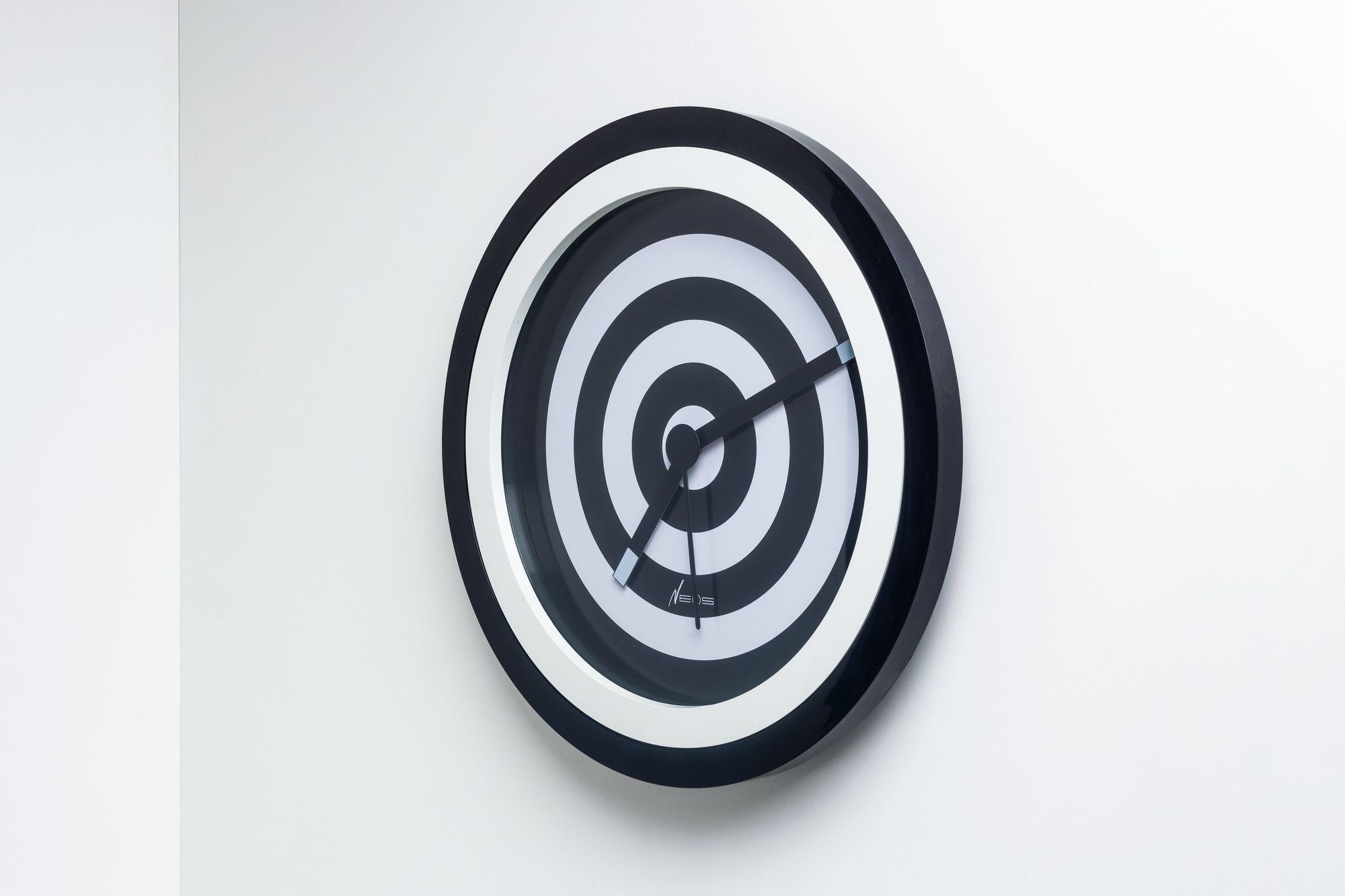 Neos Lorenz du Pasquier & Sowden Postmodern Clock
A black and white, bullseye-like design plastic postmodern wall clock with yellow hands and numbers designed by Nathalie du Pasquier and George Sowden for Neos of Lorenz in the late 1980s.