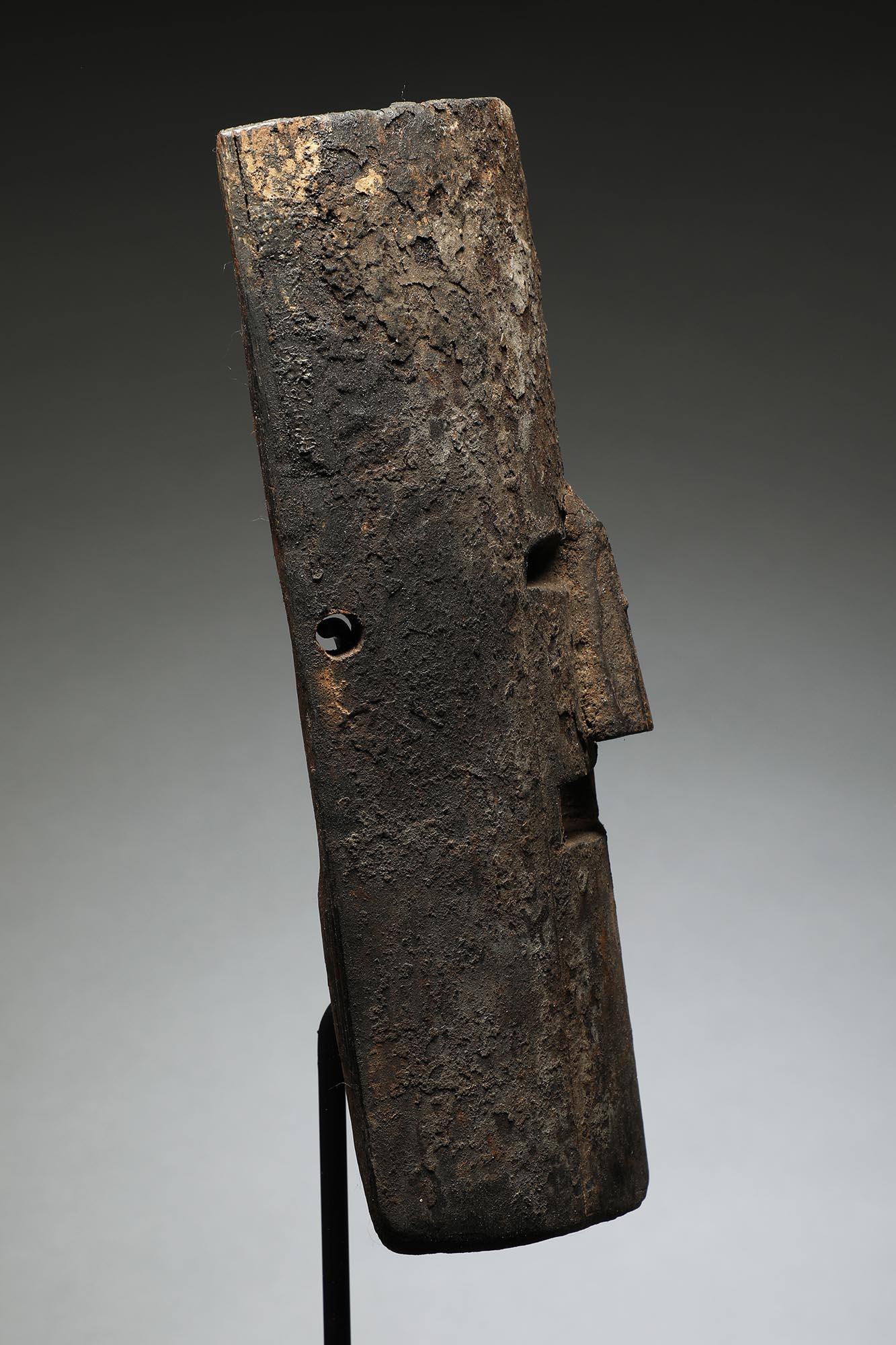 Nepal wood dance mask in half cylindrical form with cut out open eyes and mouth.  Heavily encrusted surface, very good age from traditional use.

Ex- private collection in California, 

From the 19th to early 20th century. 

Mask 10 inches high. On