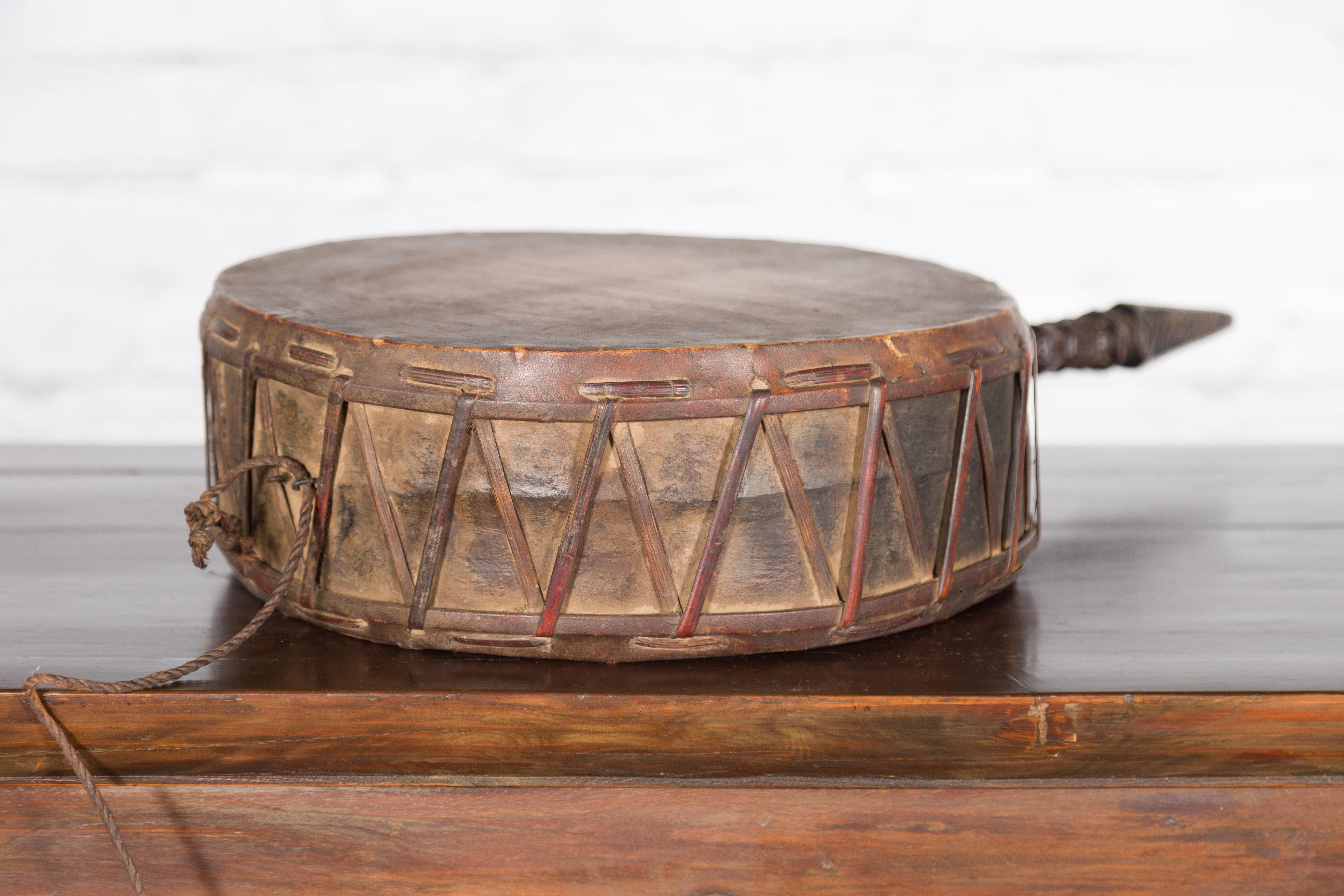 19th Century Nepalese Antique Leather Hand Drum with Carved Wooden Handle For Sale