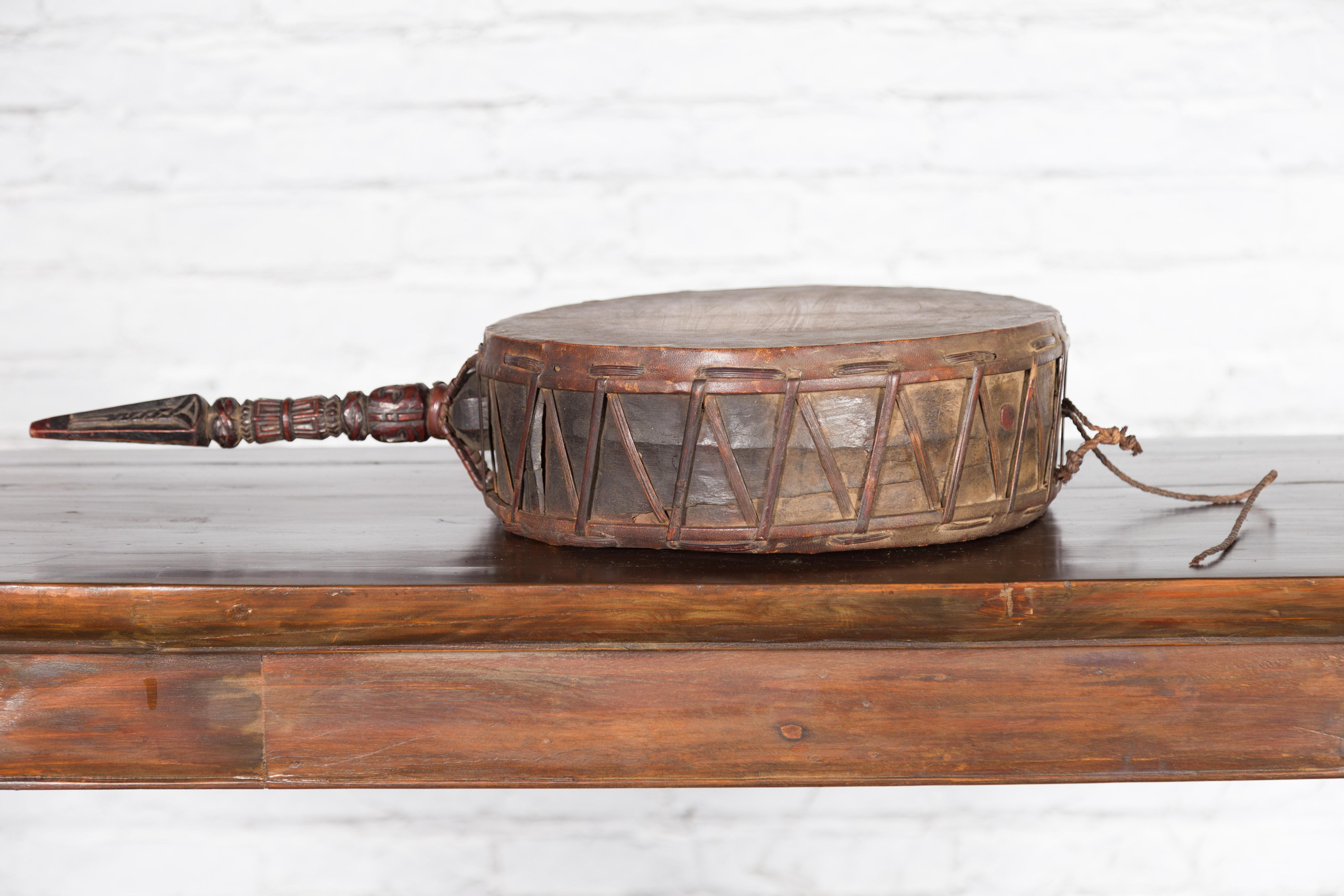 Nepalese Antique Leather Hand Drum with Carved Wooden Handle For Sale 2