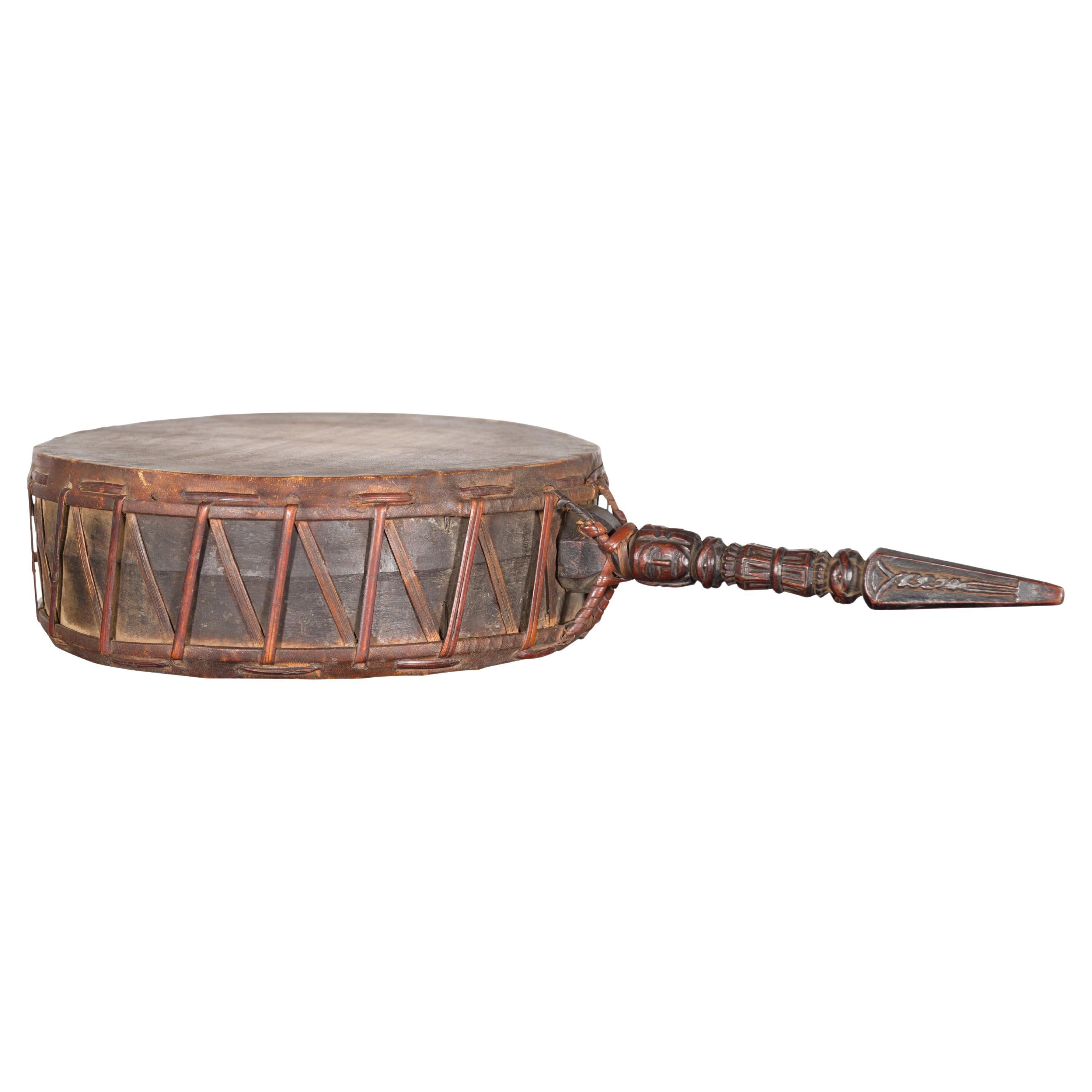 Nepalese Antique Leather Hand Drum with Carved Wooden Handle For Sale