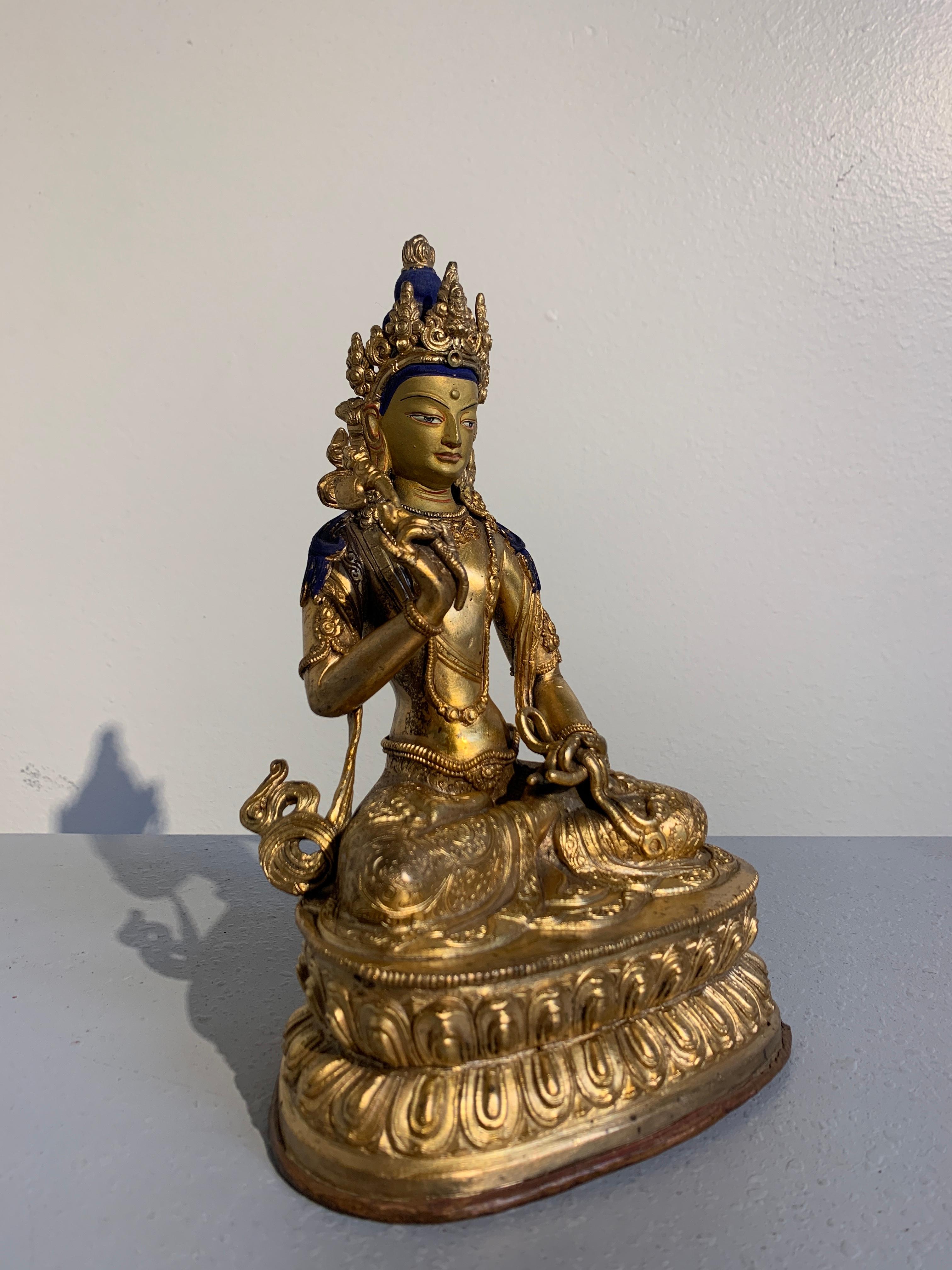 A beautiful and unusual gilt bronze figure of a Bodhisattva, possibly Amoghapasha, Nepal, early to mid-20th century, circa 1930s or 1940s.

The regal figure possibly depicting the bodhisattva Amoghapasha, the Unfailing Lasso. The enlightened being