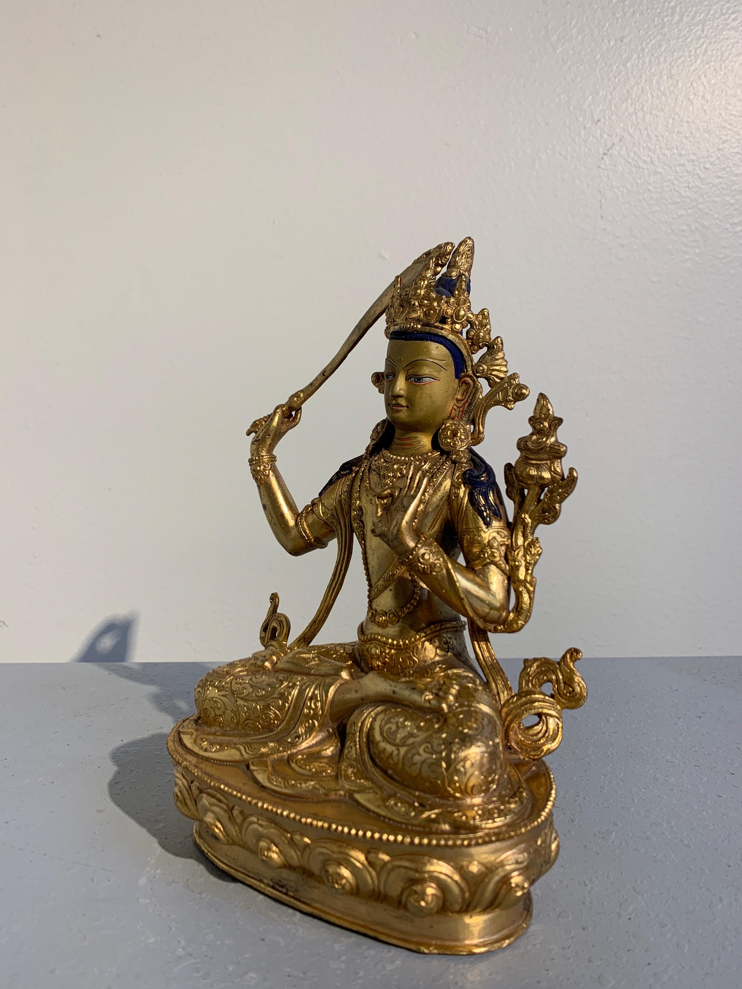 Cold-Painted Nepalese Gilt Bronze Buddhist Figure of Manjushri, Early to Mid-20th Century For Sale
