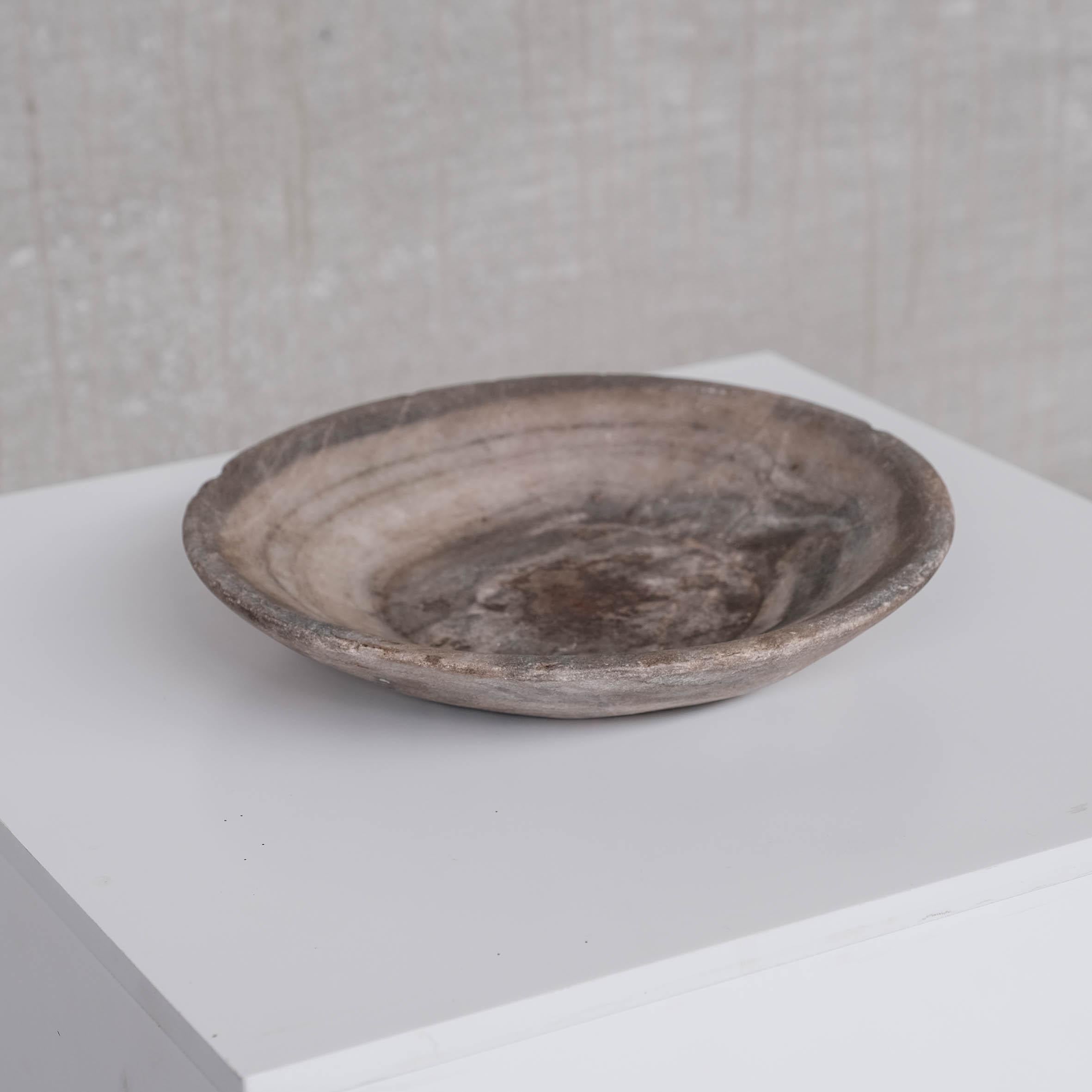A primitive style marble or stone bowl or platter. 

Medium size. 

Nepal, c1920s. 

Good condition. 

Ideal for a wabi-sabi style. Very tactile. 

Location: Belgium Gallery. 

Dimensions: 4 height x 26 Diameter in cm. 

Delivery: