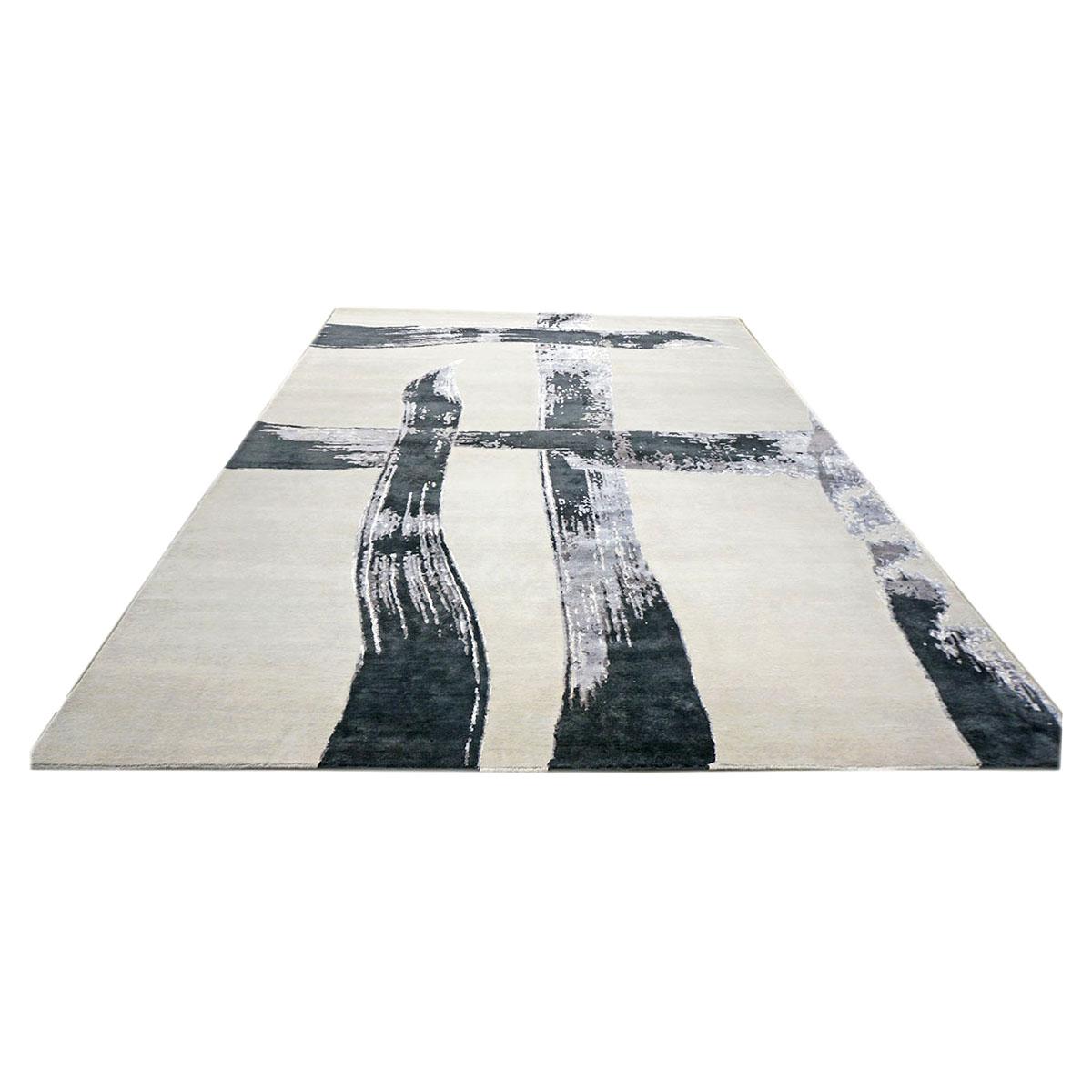 Ashly fine rugs presents a New Modern inspired wool & silk 8x10 ivory, black, & grey handmade area rug with lustrous shiny fibers and a thick durable pile. This gorgeous collection has been designed by our in-house designer and handmade by the