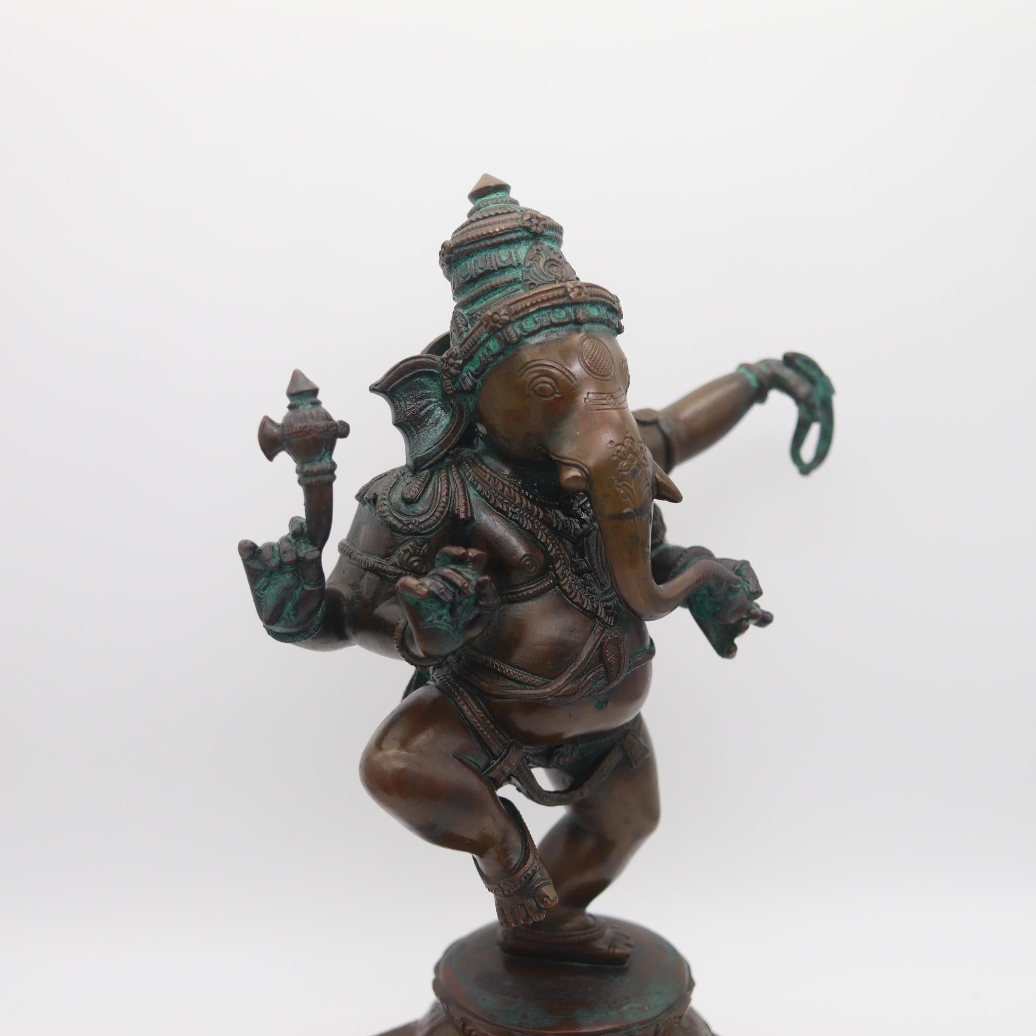 Nepalese-Tibetan sculpture of Ganesha.

A splendid Hindu religious bronze sculpture of a dancing Ganesha of Tibetan or Nepalese origin, created back in the 19th century circa 1850. This statue is similar to the Chola style, highly detailed with