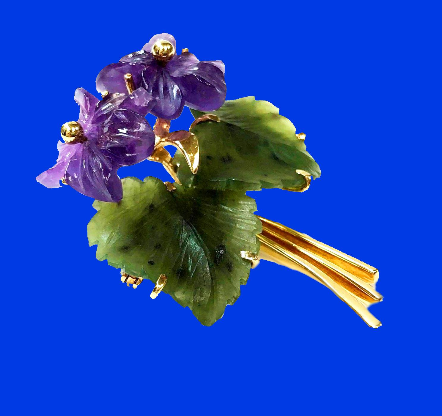 Nephrite, Amethyst 14K Brooch, Franz Breuning Germany C.1950. The brooch with two foliate amethyst flowers, set in the centre with gold stigma and stamen the surrounding foliage of large carved nephrite leaves, all surmounted on gold branch stem. FB