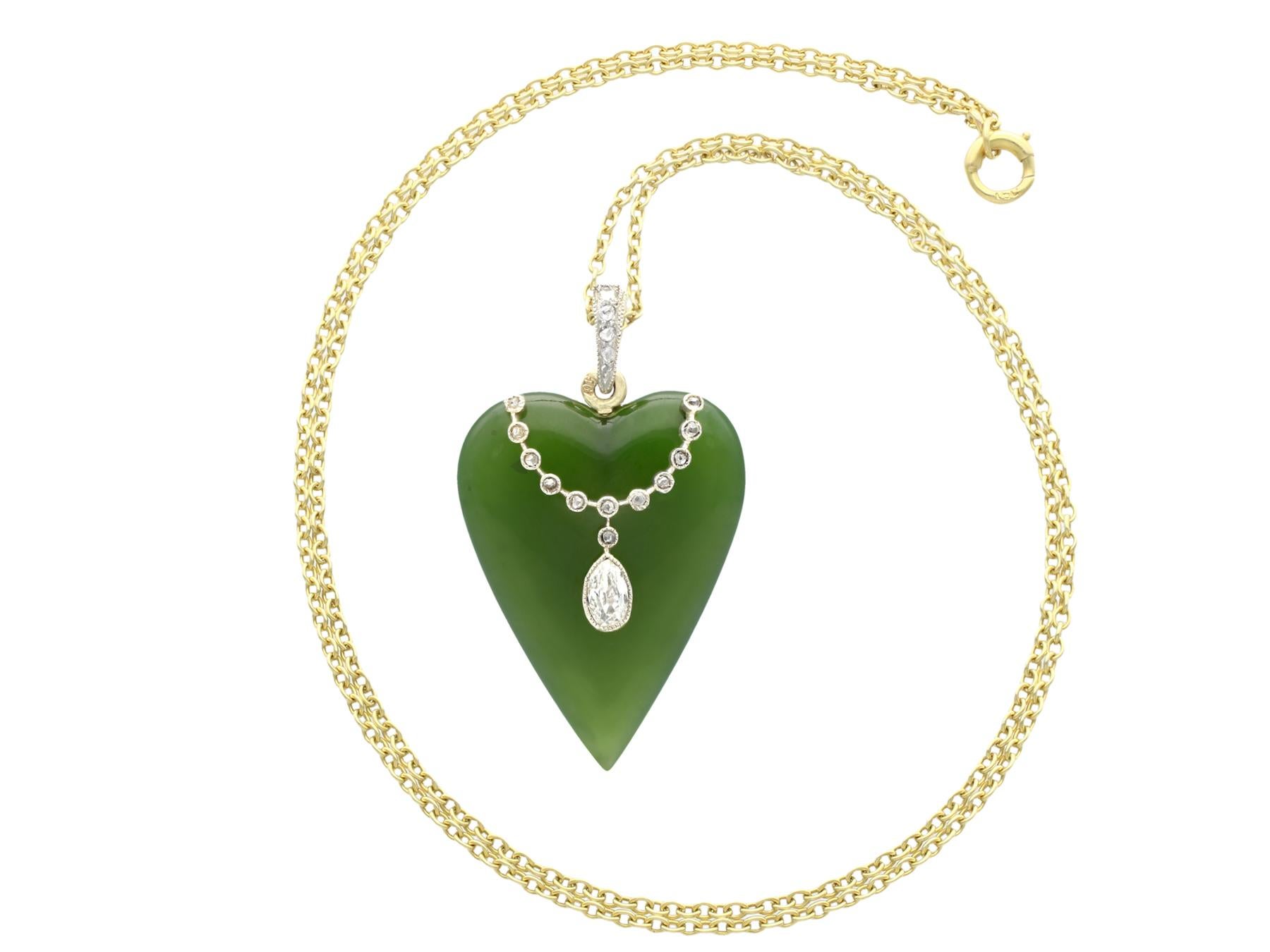 A stunning antique 21.71 carat nephrite jade and 0.54 carat diamond, 15 karat yellow gold and silver set pendant; part of our diverse antique jewelry and estate jewelry collections.

This stunning, fine and impressive antique pendant has been