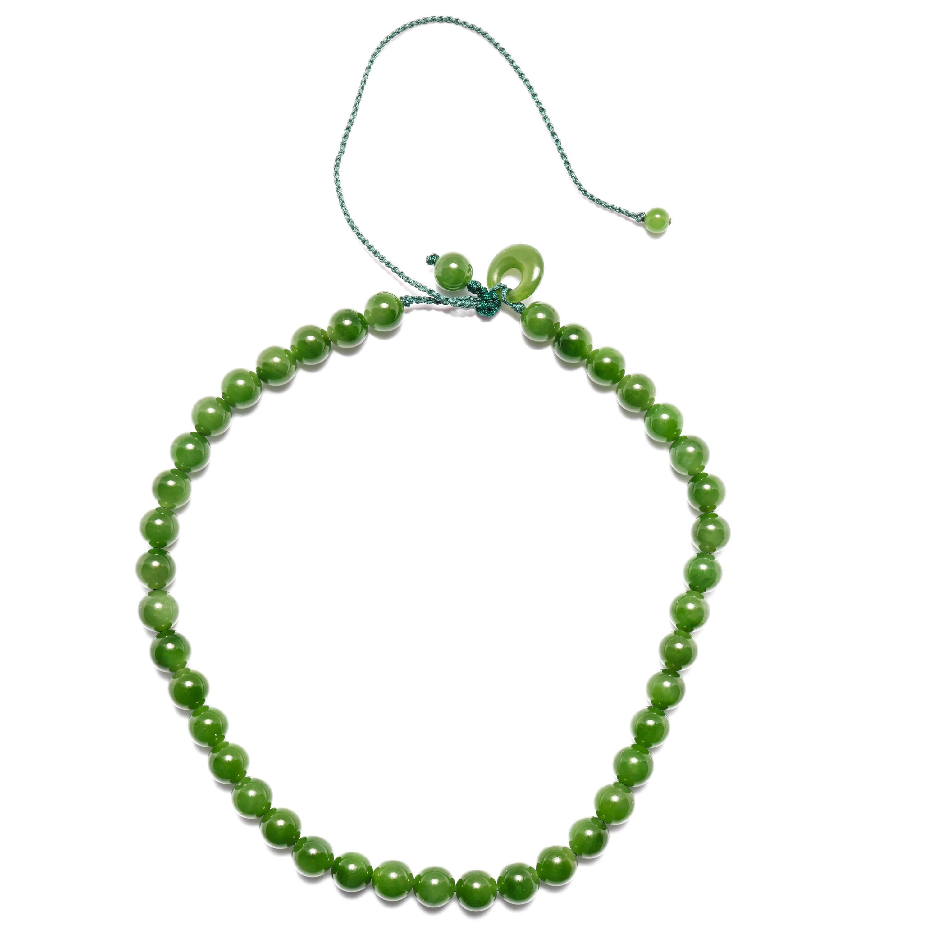 This is a brand new, handmade necklace created from very fine, highly translucent green nephrite jade beads, ranging in size from 9.4mm -9.7mm. The forrest-green color is evenly distributed throughout the 41 beads. There is a sliding knot to adjust