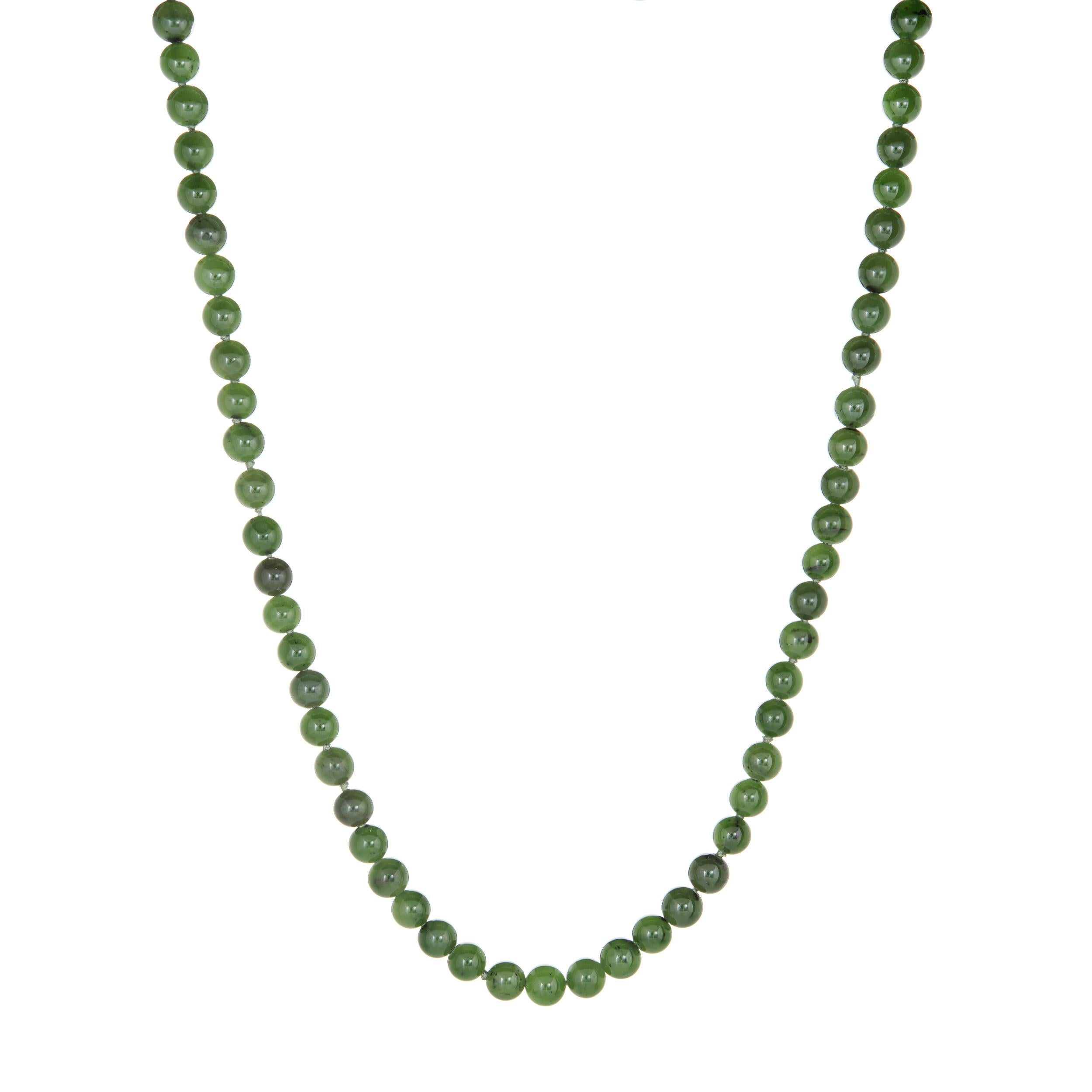 Finely detailed vintage nephrite jade necklace, finished with a 14k yellow gold clasp (circa 1950s to 1960s). 

Jade beads are uniform in size and measure 7.5mm. The jade is in very good condition and free of cracks or chips. The jade beads are