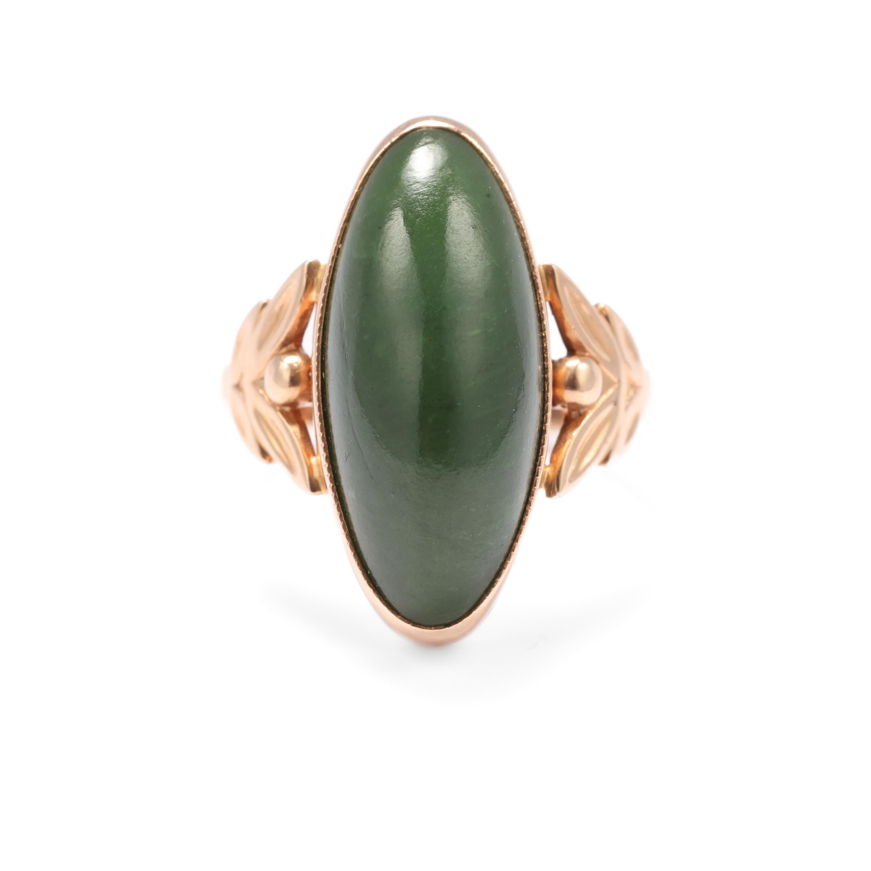 Here we have a gorgeous Art Nouveau style (circa 1970s) nephrite jade ring handmade in Russia from distinctive coppery, 14k rose gold. The elegant, lengthy navette cabochon measures approximately 22mm x 9mm and the ring rises off the finger 8.22mm.