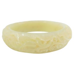 Bracelet jonc en jade blanc néphrite, sculpture creuse, motif de fleurs et de phénix