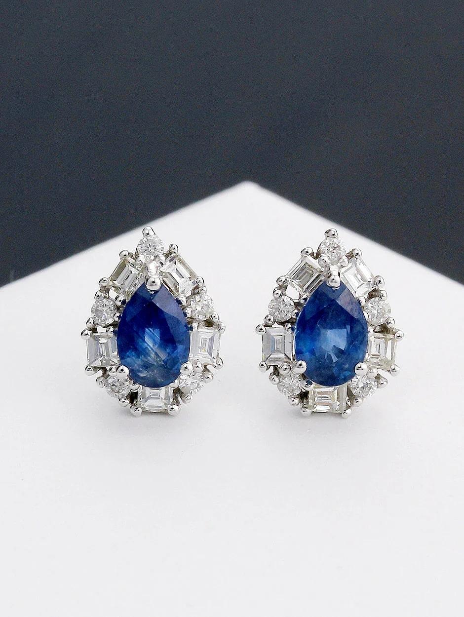 Stud teardrop design sapphire earring, all with a high polish finish. Available in 18K White Gold.

Diamond Type : Natural Diamond
Metal : 18K
Metal Color : White Gold
Diamond Carat Weight : 0.30ttcw
Sapphire Carat Weight : 1.10ttcw
Diamond Color