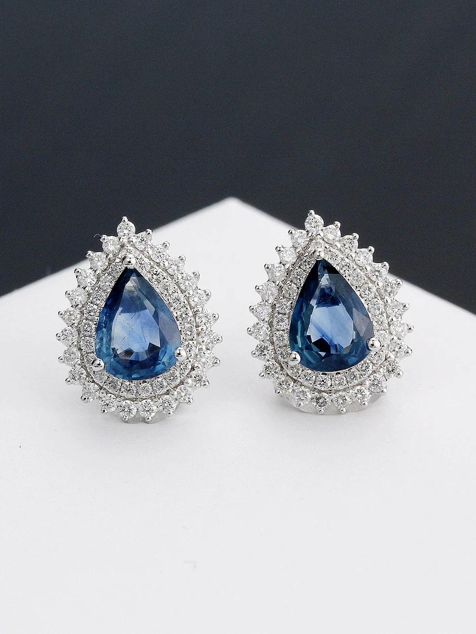 Tear drop design sapphire earring, all with a high polish finish. Available in 18K White Gold.

Ring Information
Diamond Type : Natural Diamond
Metal : 18K
Metal Color : White Gold
Diamond Color Clarity : SI-Quality / H-Color
Diamond Carat Weight :