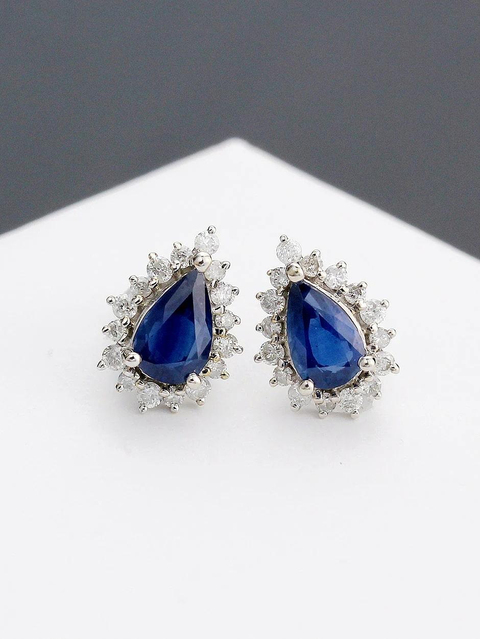 Stud tear drop design sapphire earring, all with a high polish finish. Available in 18K White Gold.

Earring Information
Diamond Type : Natural Diamond
Metal : 18K
Metal Color : Yellow Gold
Diamond Color Clarity : SI-Quality / H-Color
Diamond Carat