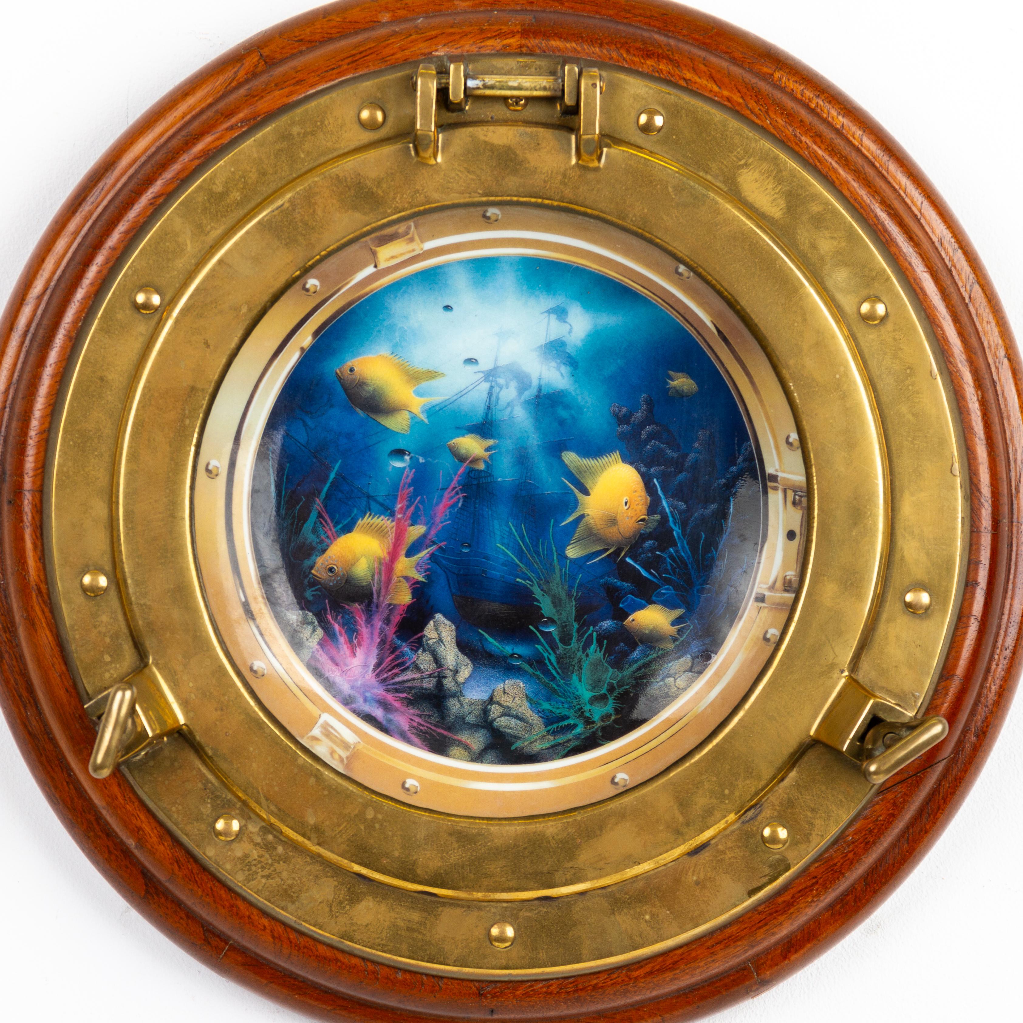 Neptune's Porthole Brass & Porcelain Wall Hanging 
Good condition overall

Free international shipping.