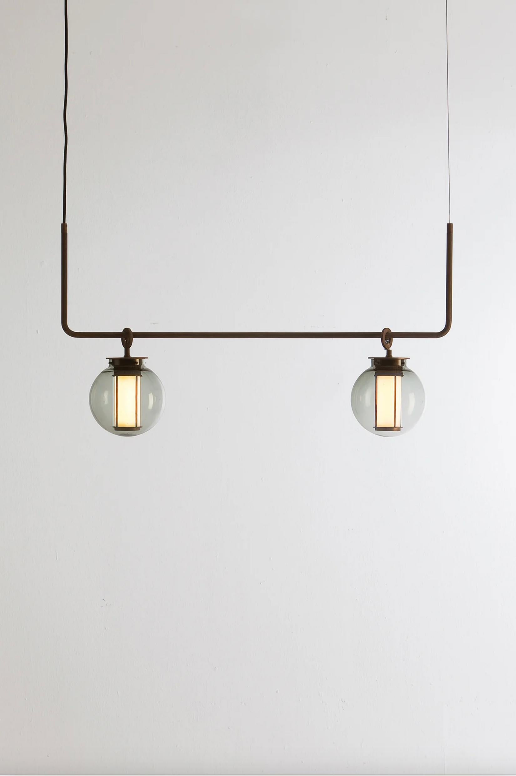 Neri and Hu Bai T Chandelier II Suspension Lamp For Parachilna

This collection is inspired by traditional Chinese lanterns. This version however, is a sophisticated one. Made by an aged bronze metallic structure and a meticulously hand-blown