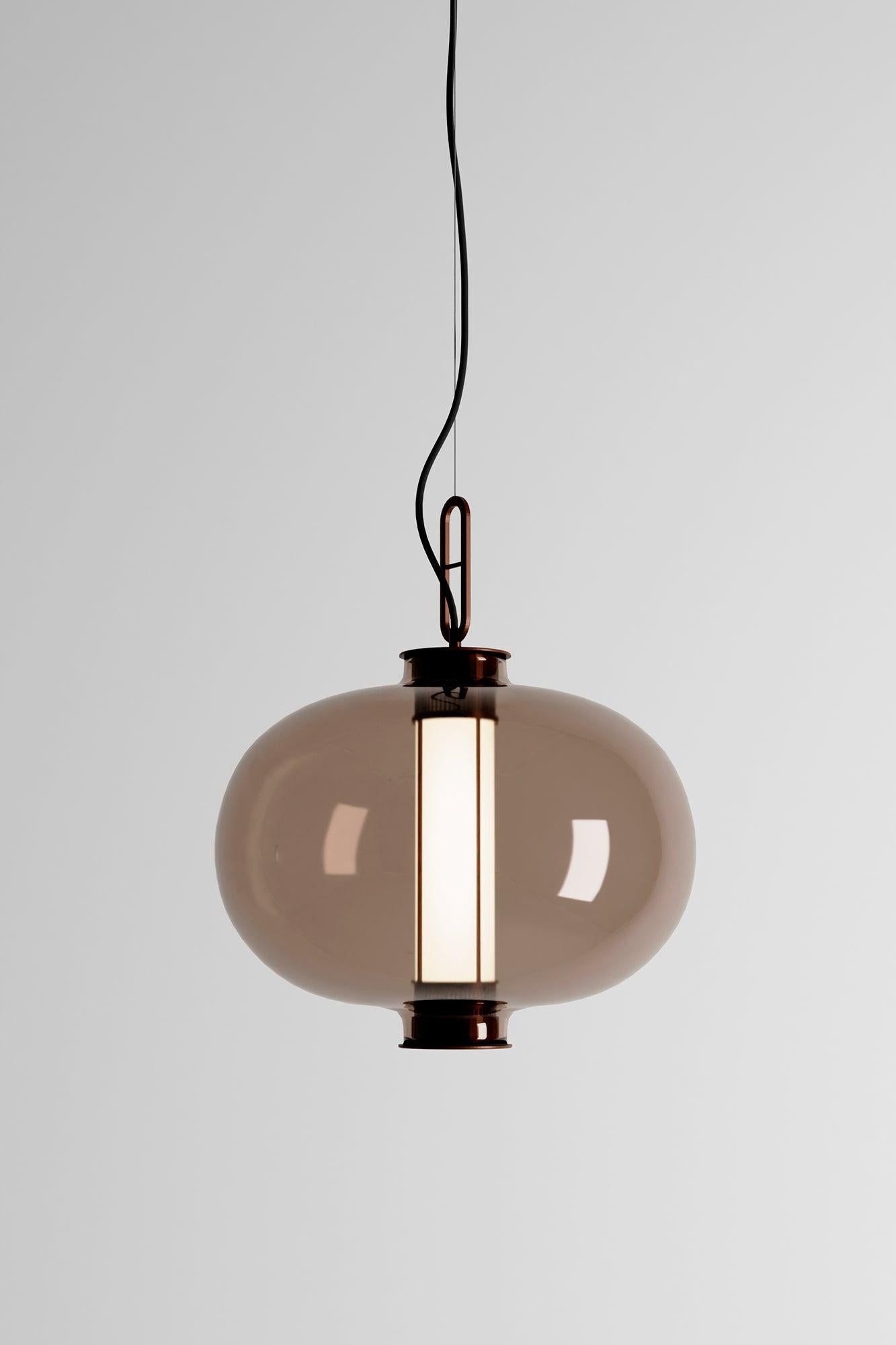 BAI T MA MA 

Suspension lamp, model BAI T MA MA, designed by Neri & Hu in 2014. 
Manufactured by Parachilna. 

This collection is inspired by traditional Chinese lanterns. This version however, is a sophisticated one. Made of an aged bronze