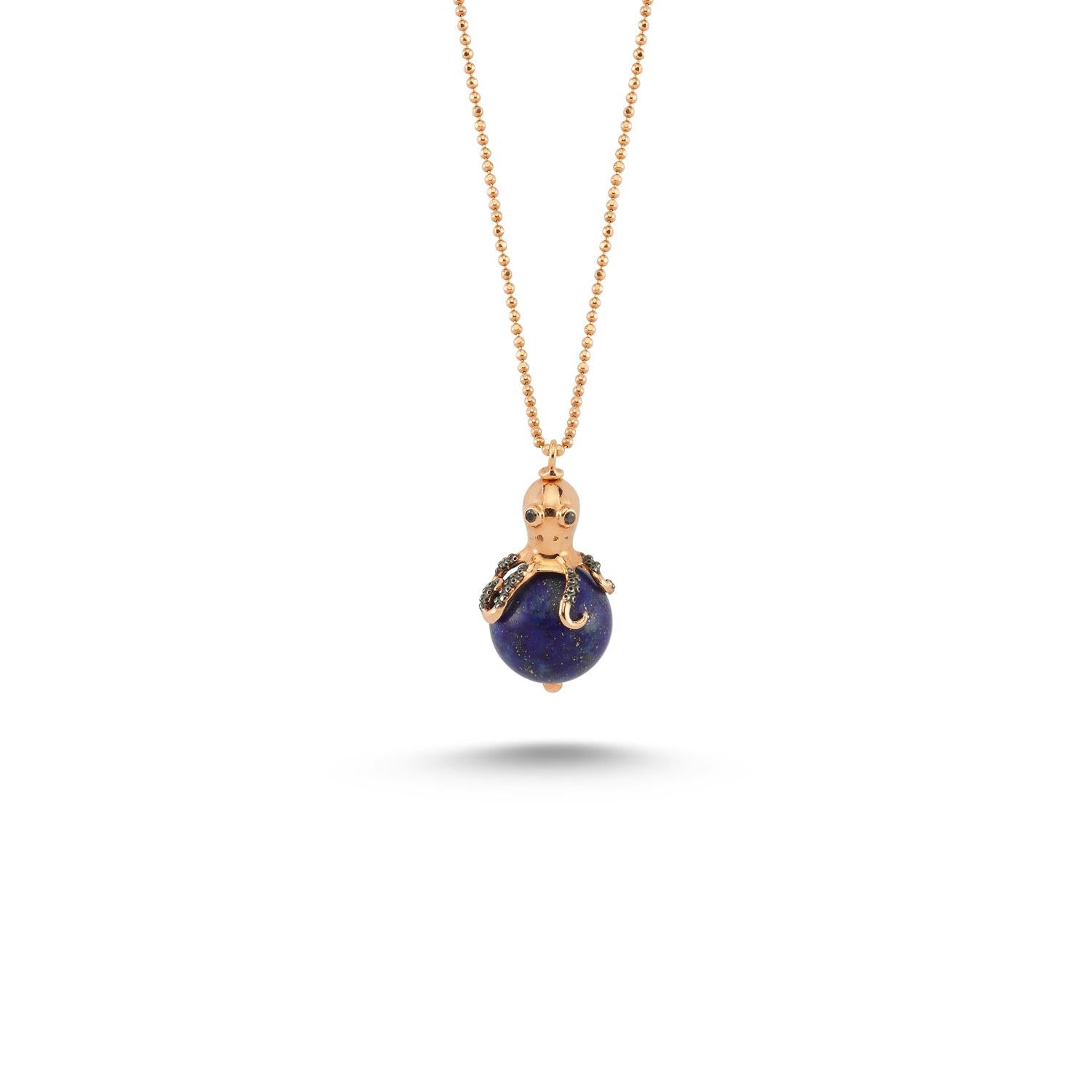 Nerice lapis mini octopus necklace in 14k rose gold by Selda Jewellery

Additional Information:-
Collection: Treasures of The Sea Collection
14k Rose gold
0.02ct Black diamond
Pendant height 2cm
Chain length 44cm