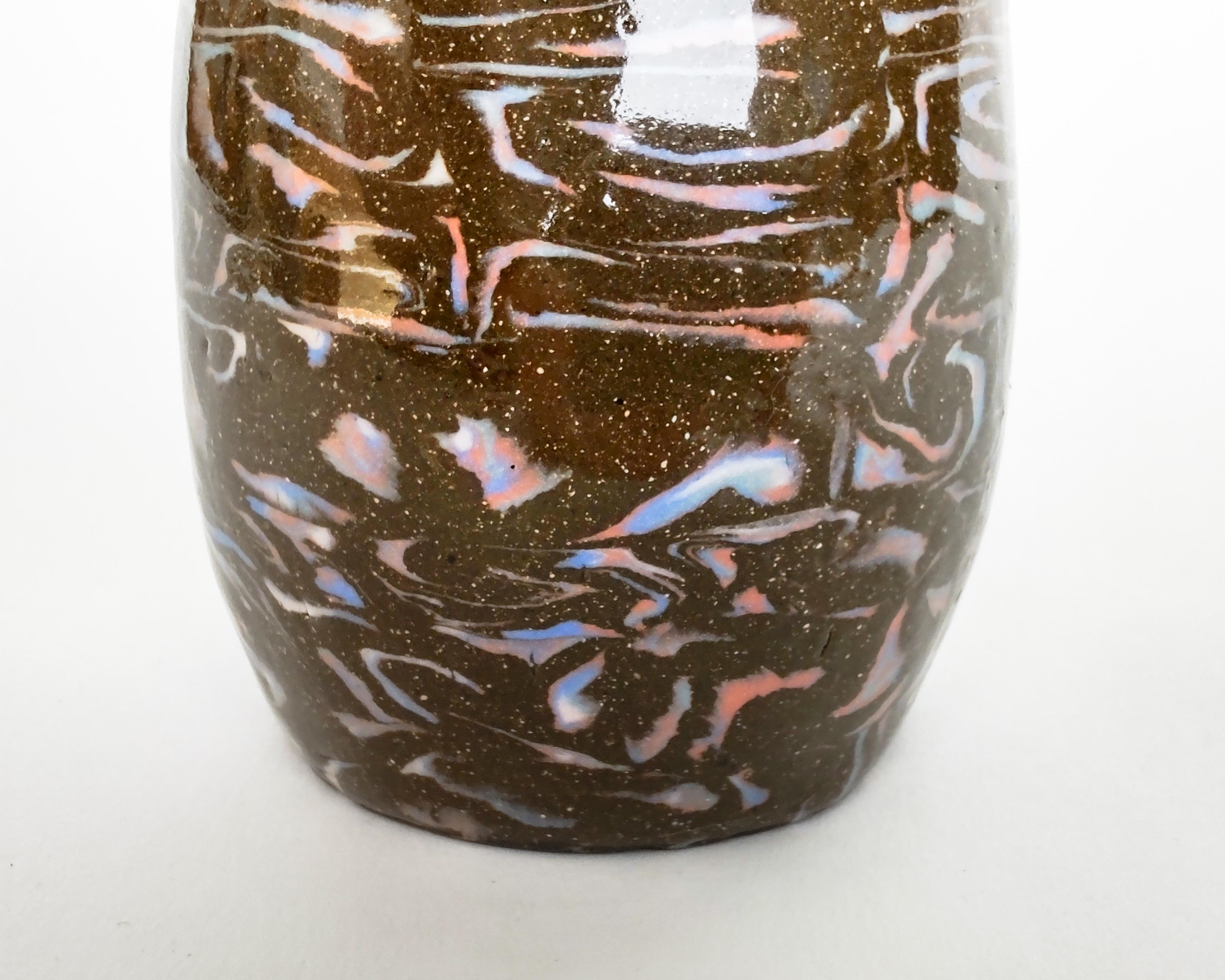 Handmade nerikomi vase with multiple colored clays. Black-brown speckled clay with colorful marbled squiggles integral to the vase. Made and fired in Los Angeles by Fizzy Ceramics in 2022. Glazed clear on the outside and inside, the black clay turns