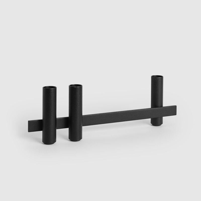 Nero candle holder by Mason Editions
Dimensions: 31 × 5 × 10 cm
Materials: iron
Colors: black, matte 24K gold, cotto, sage green and light grey.

Consisting of a longitudinal metal bar supporting cylindrical elements on both sides, Petit is an
