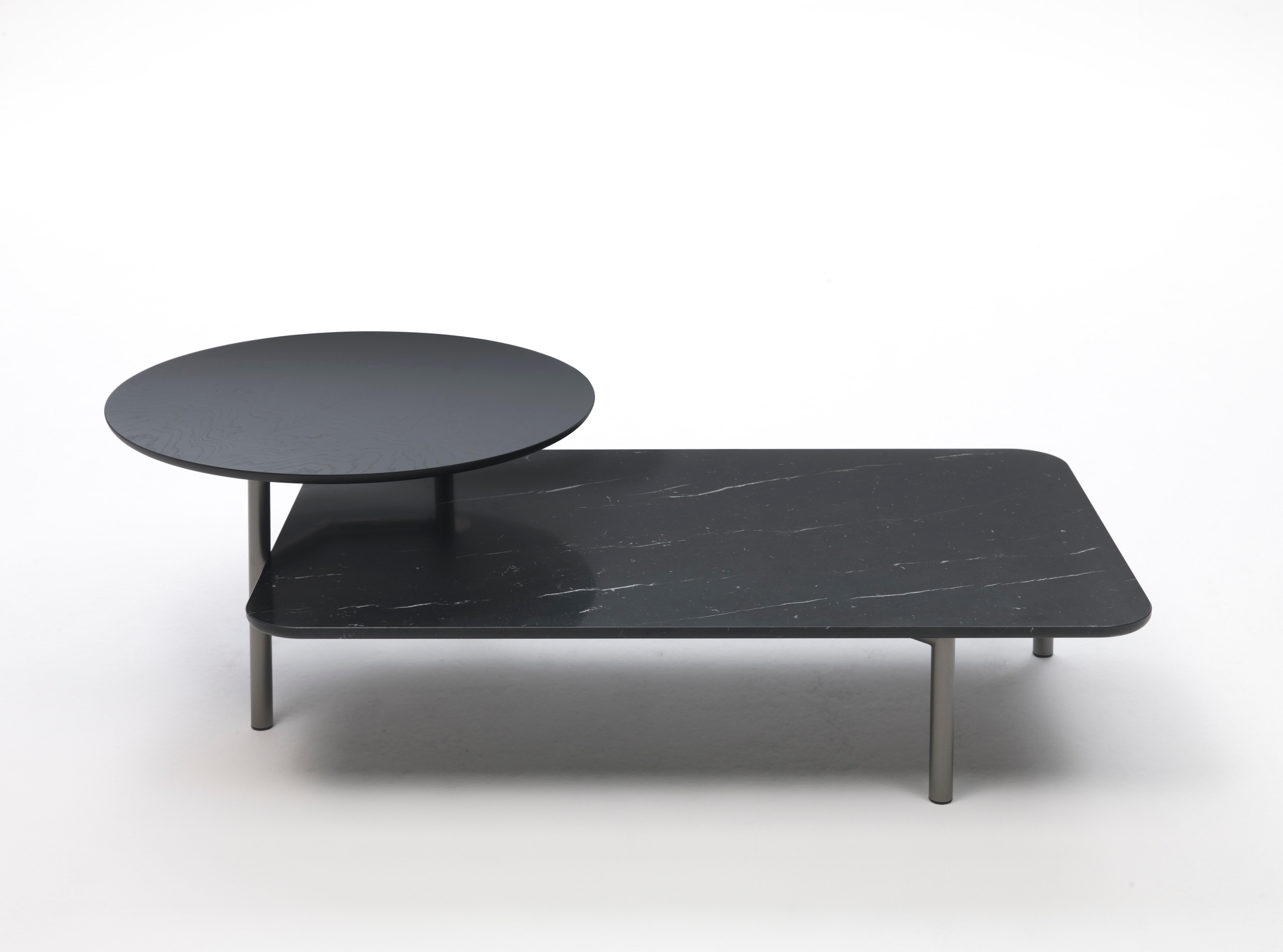 Nero marble bitop coffee table by Rodolfo Dordoni
Materials: Base in bronze lacquered metal. 2 versions of tops: black Marquina marble, white Carrara marble, or gray smoked glass
Technique: Lacquered metal, polished marble. 
Dimensions: 140 x 85