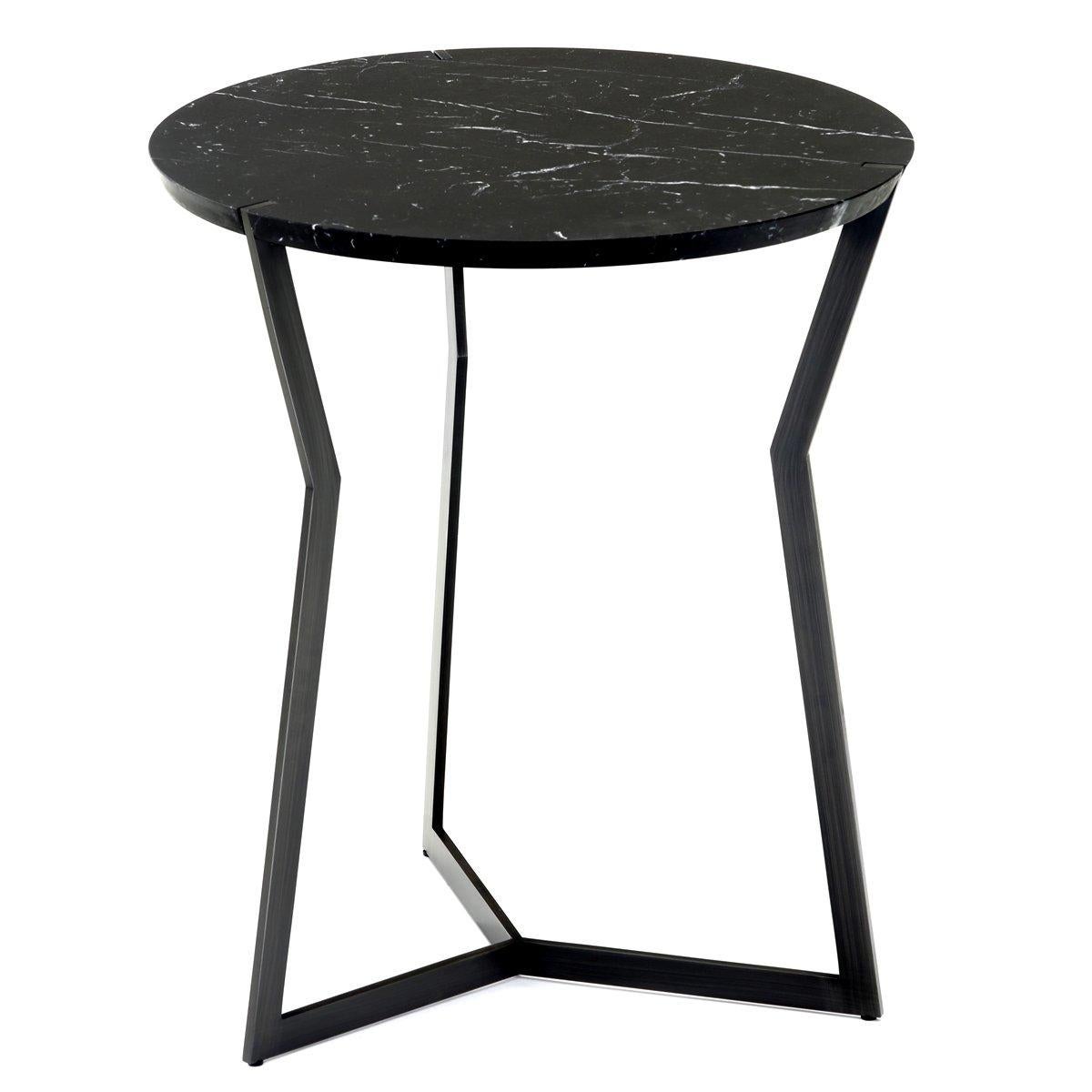 Nero marble star side table by Olivier Gagnère
Materials: pedestal table, 20mm Carrara or Marquina marble top. Base in black bronze finish or gold lacquered metal.
Technique: lacquered metal, polished marble. 
Dimensions: diameter 50 x height 57