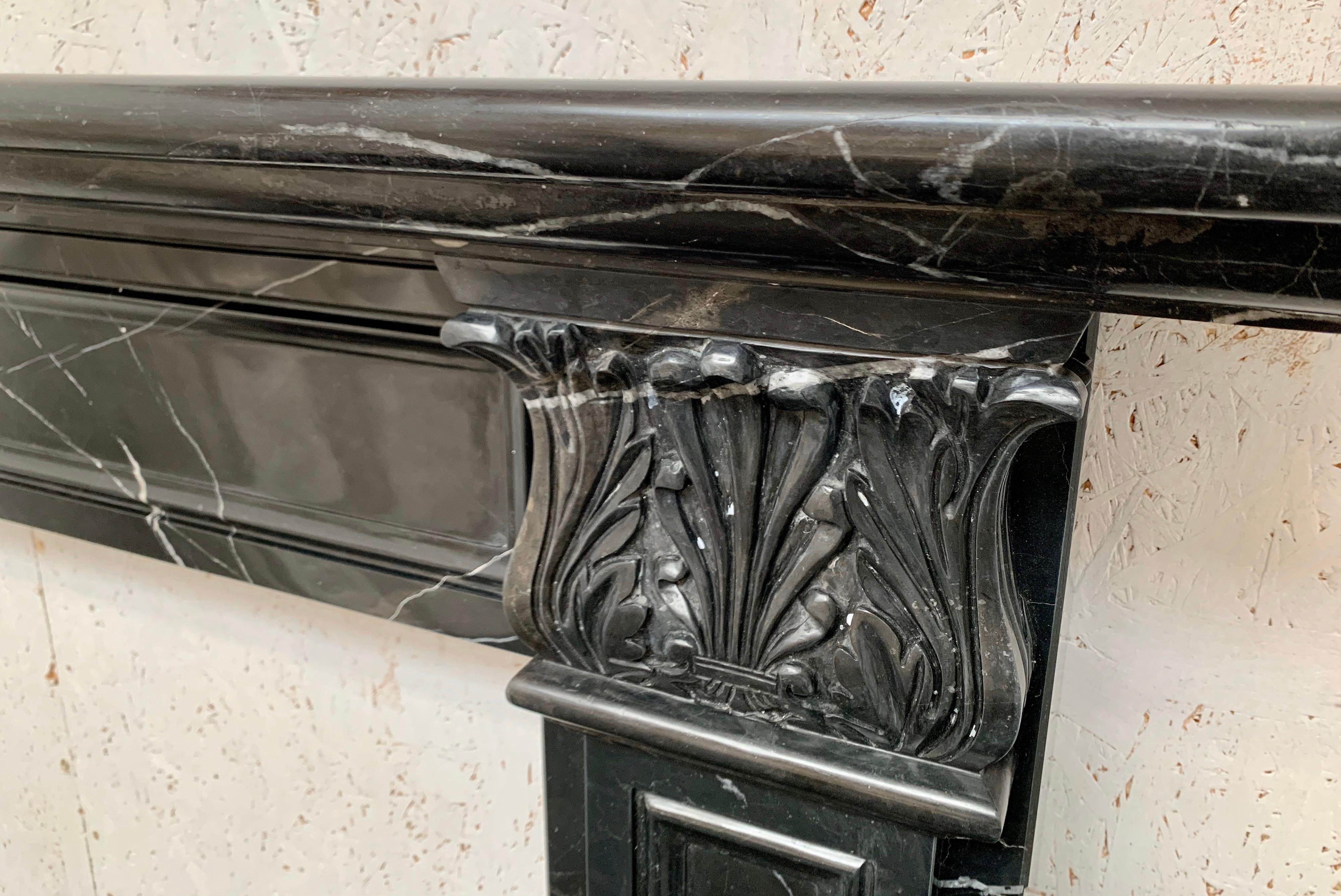 A beautiful hand carved marble fireplace.
With delightful white Veinage, classical pilasters with finely hand carved anthemion-leaf capitals distinguish this Regency style chimneypiece.
A restrained design capable of adapting to any environment.