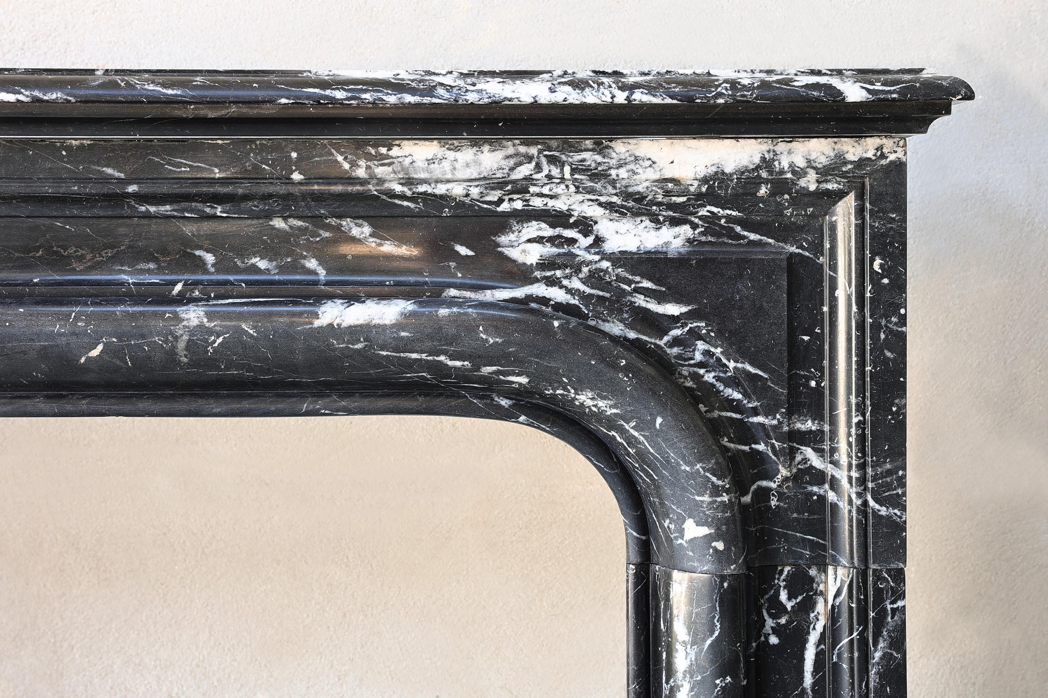 French Nero Marquina marble fireplace from the 19th century in style of Louis XIV