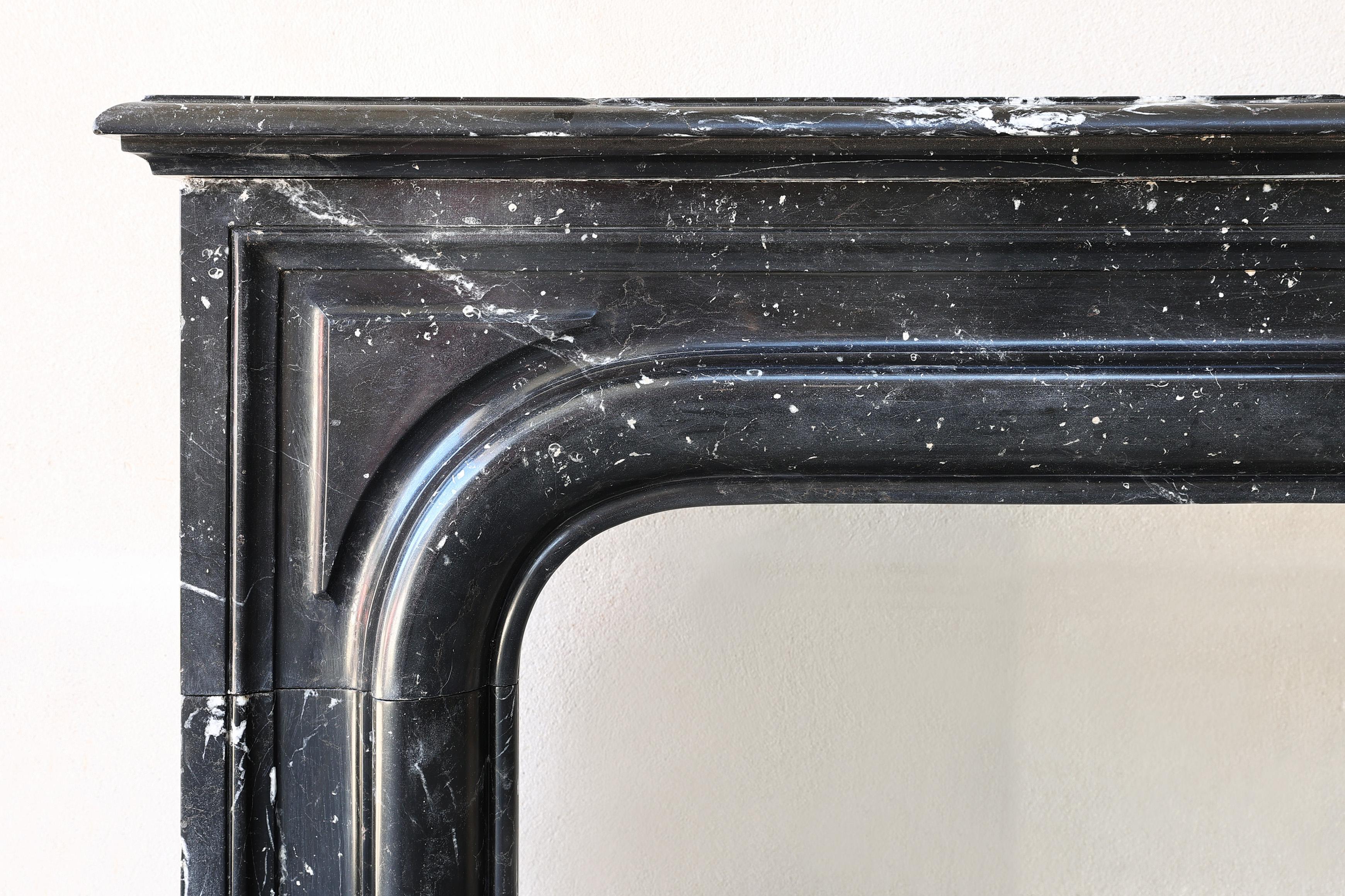 19th Century Nero Marquina marble fireplace from the 19th century in style of Louis XIV