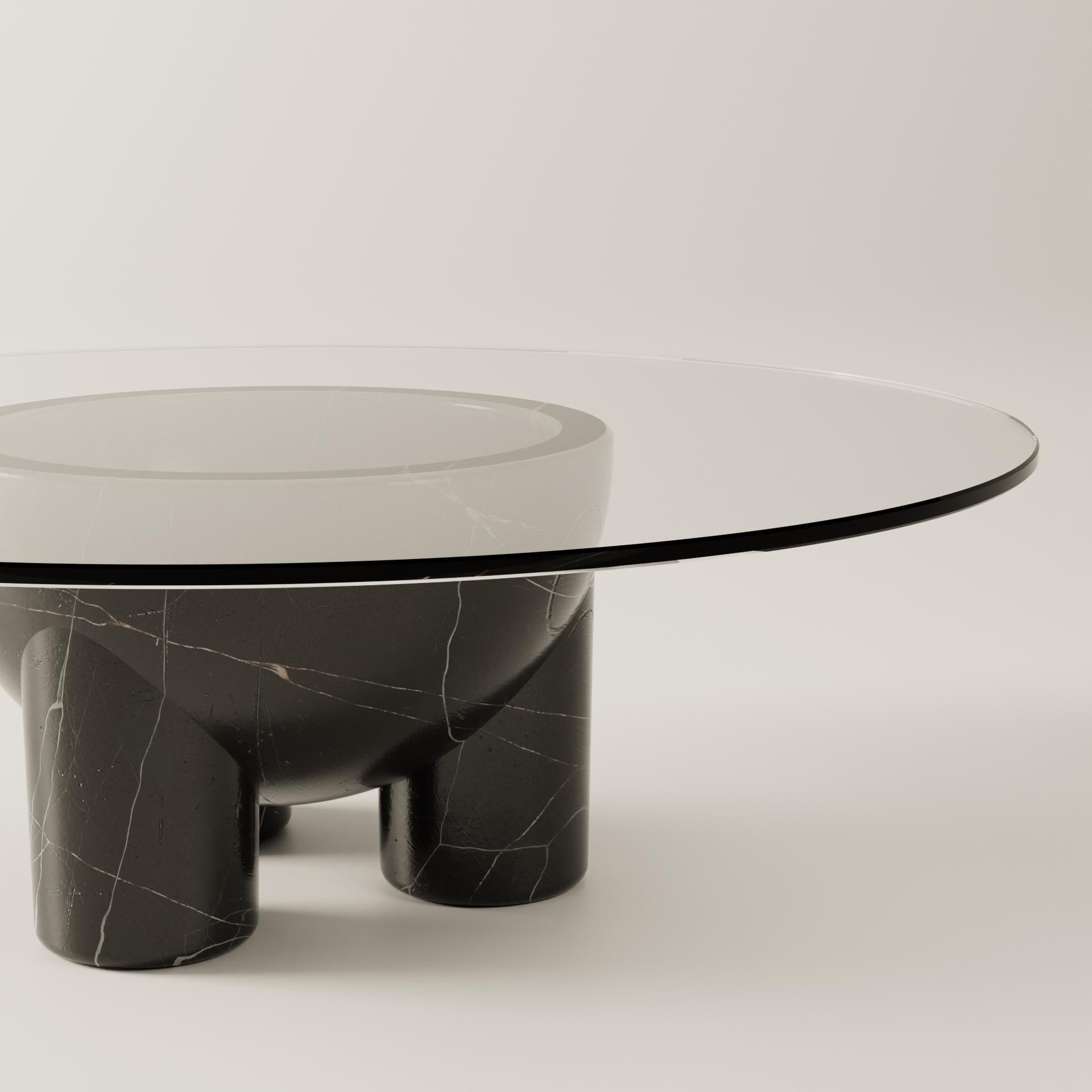 Clean lines, simple geometry and strong materiality are the main features of BURGIO's U line. tAAAble is a reversible coffee table carved from a single piece of marble so the veining flows seamlessly across the unique shape of the table base.