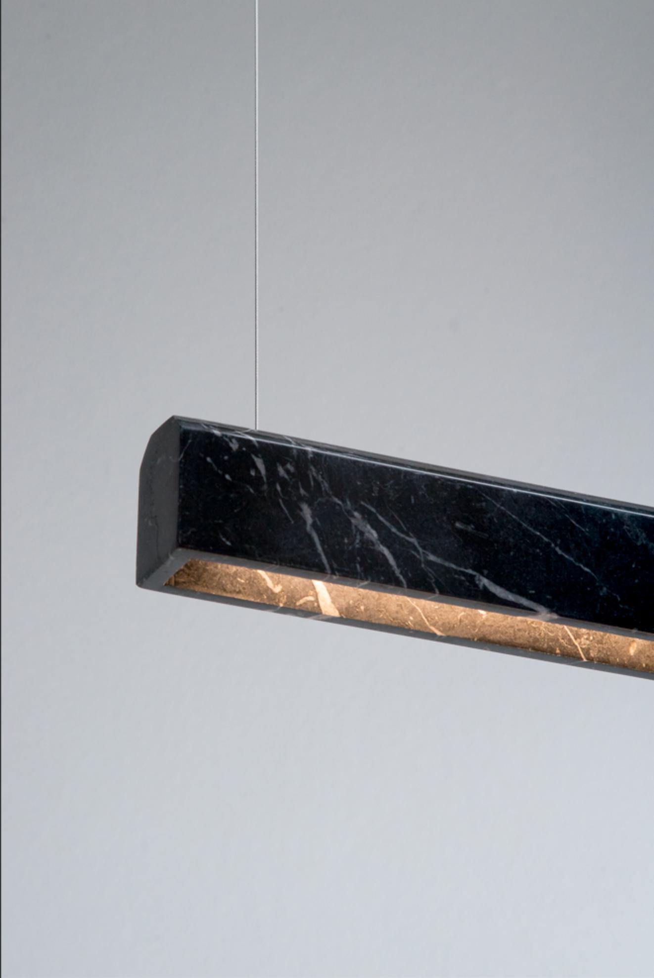 Nero Marquina Poem suspended Light by Lexavala
Dimensions: W 150 x D 4 (aprox) x H 4.5 cm 
Materials: Marble
Also available in different dimensions: 90 cm and 120 cm.

A pure, majestic and simple lamp. Choose between different materials, and