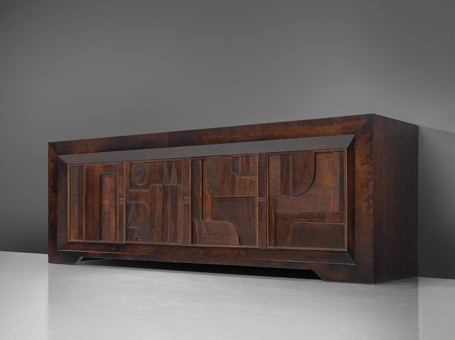 Nerone and Patuzzi for Gruppo NP2, sculptural sideboard, wood and glass, Italy, 1970s.

This rare wooden sculptural sideboard is designed by Nerone and Patuzzi for Gruppo NP2. The Abstract Constructivism sideboard features high relief doors, which