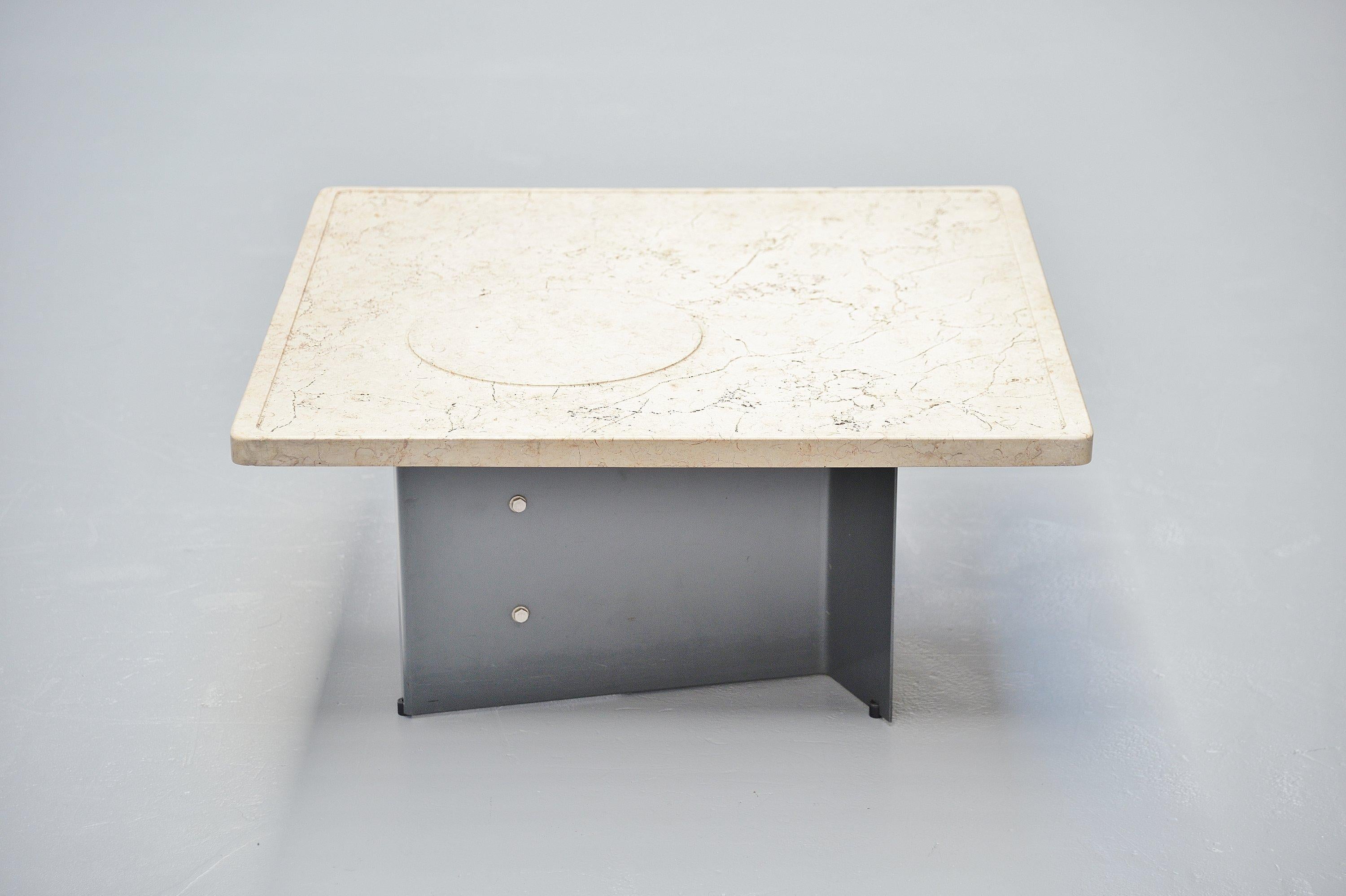 Sculptural coffee table designed by designer duo Giuseppe Nerone and Gianni Patuzzi. Manufactured by Gruppo NP2, Italy, 1966. This is for an early work by NP2, the table has a roman travertine top and a dark grey painted metal base which has a very