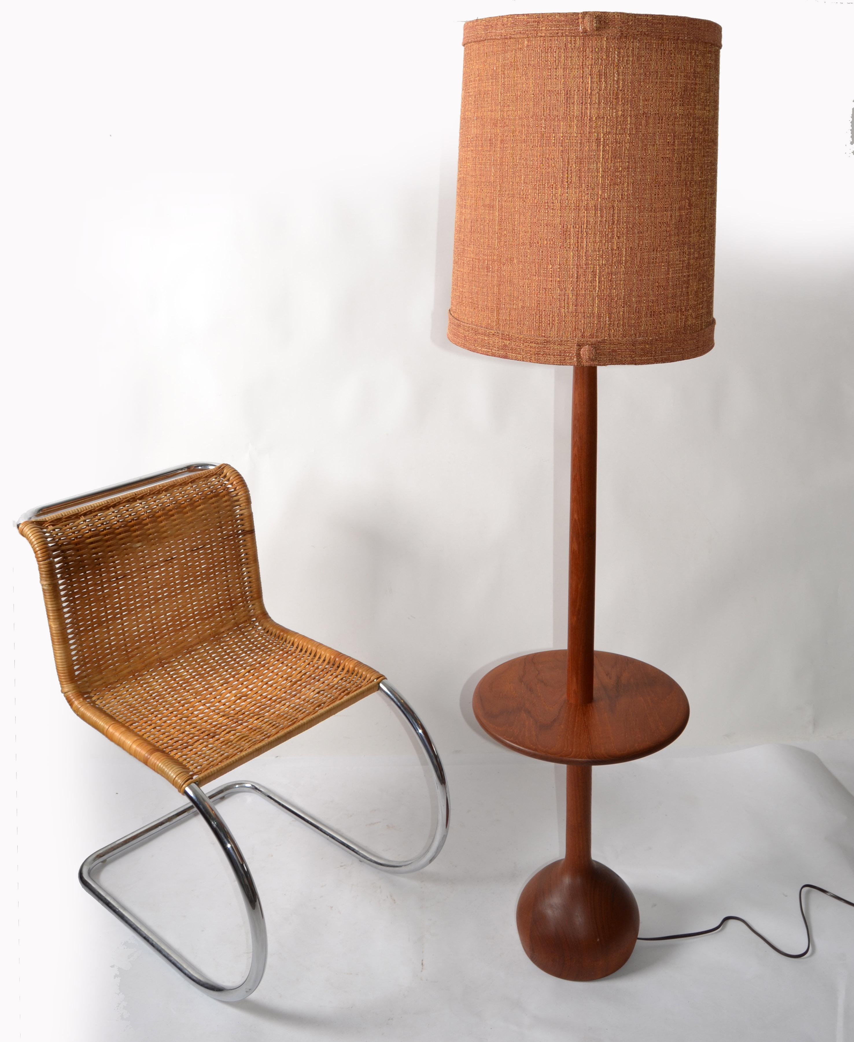 American Turned Walnut Floor Lamp with a round Center Table and Original Fabric Shade.
The handmade Stem is turned out of one piece of Walnut and has an organic round Base.
Note the stunning pattern of the Walnut Wood. 
US Rewiring and takes 1