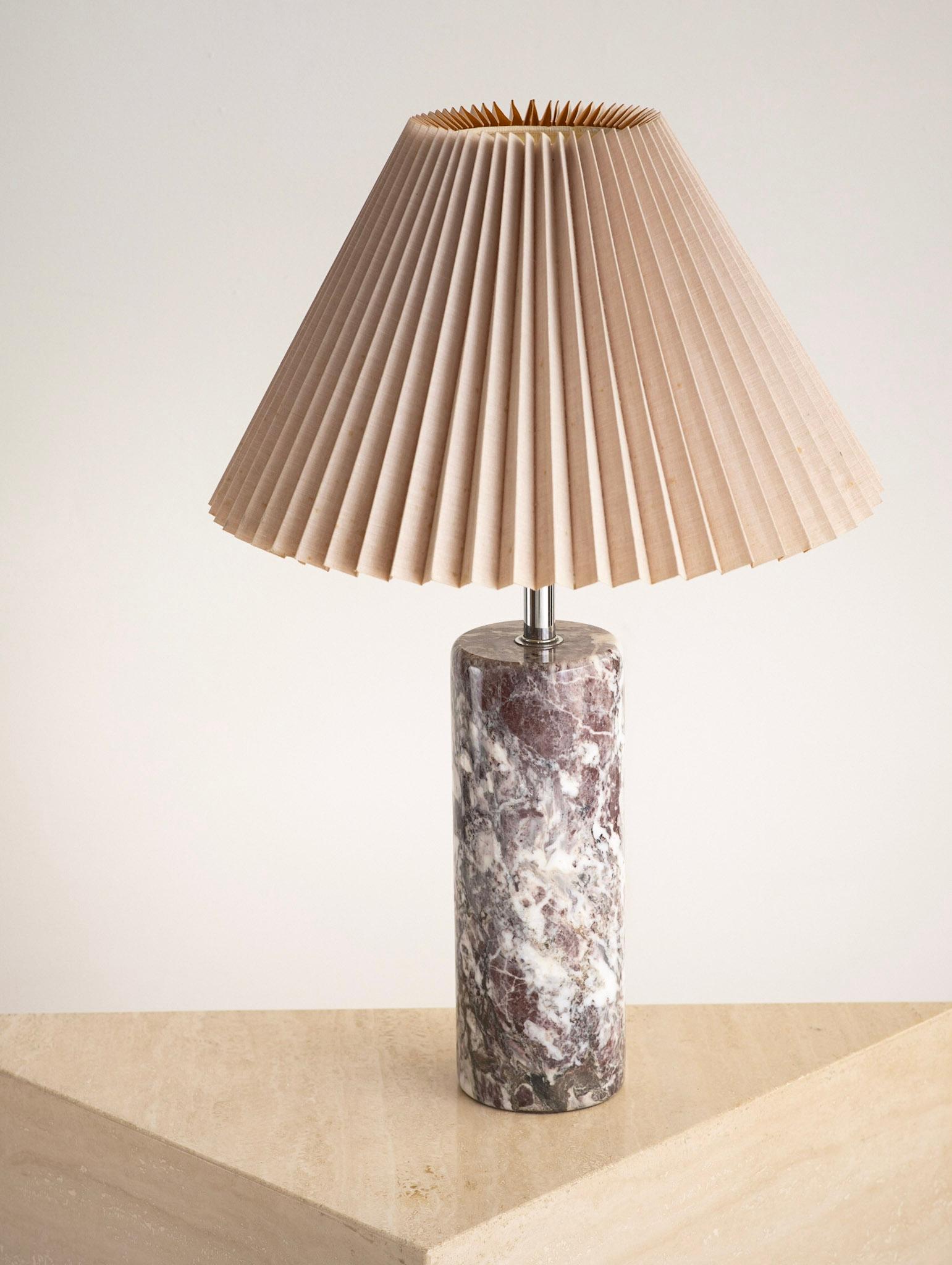 Nessen solid marble table lamp with chrome neck. Colors vary from shades of pink to whites and grays. Double bulb head and attached shade hardware. Shade not included. Marble base measures 15