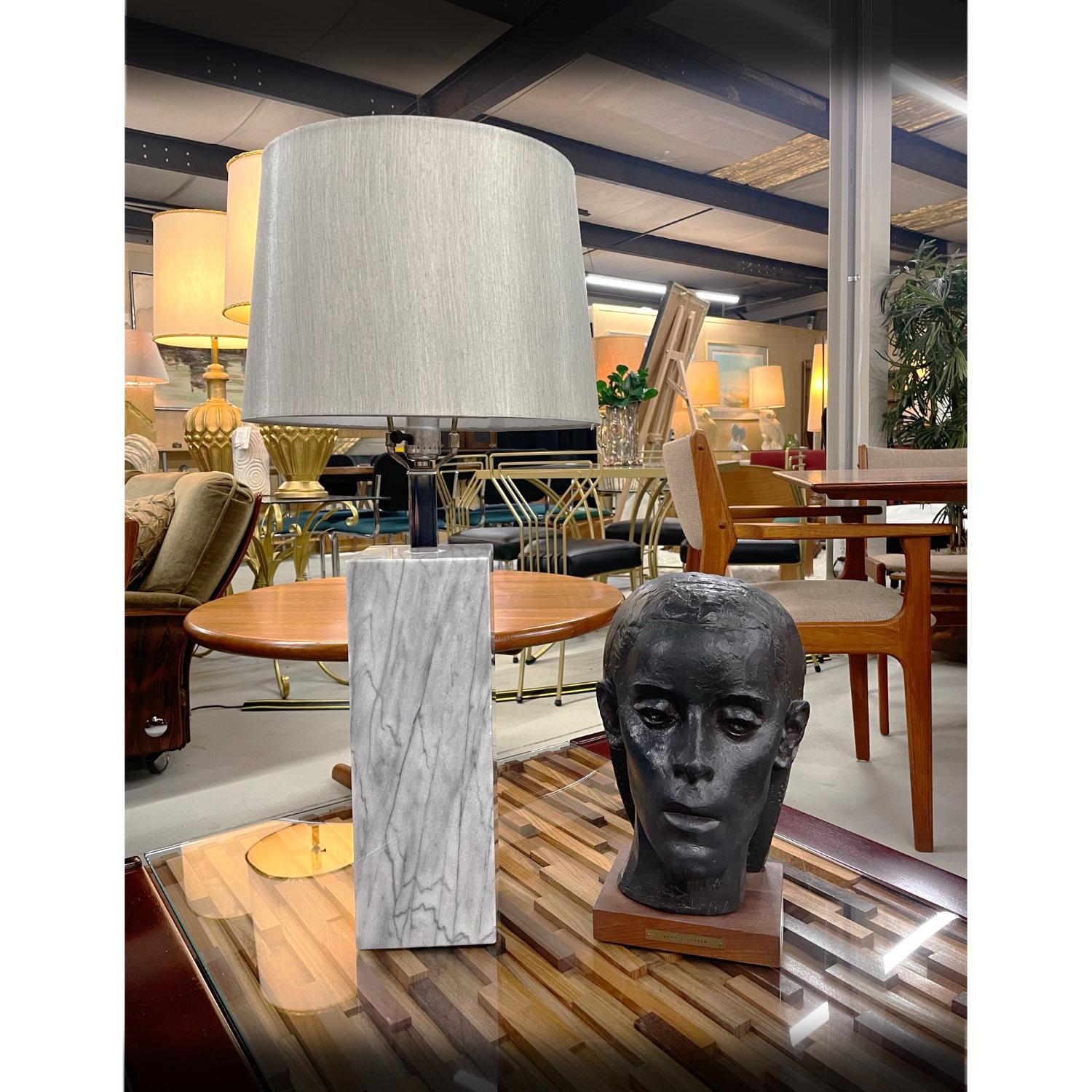 Lamp shade is NOT included with purchase.

Chic gray marble table lamp designed in the manner of Nessen. The minimalist modern lamp is a single square column with a chrome neck. The lamps takes a single bulb. LED and traditional bulbs can be used