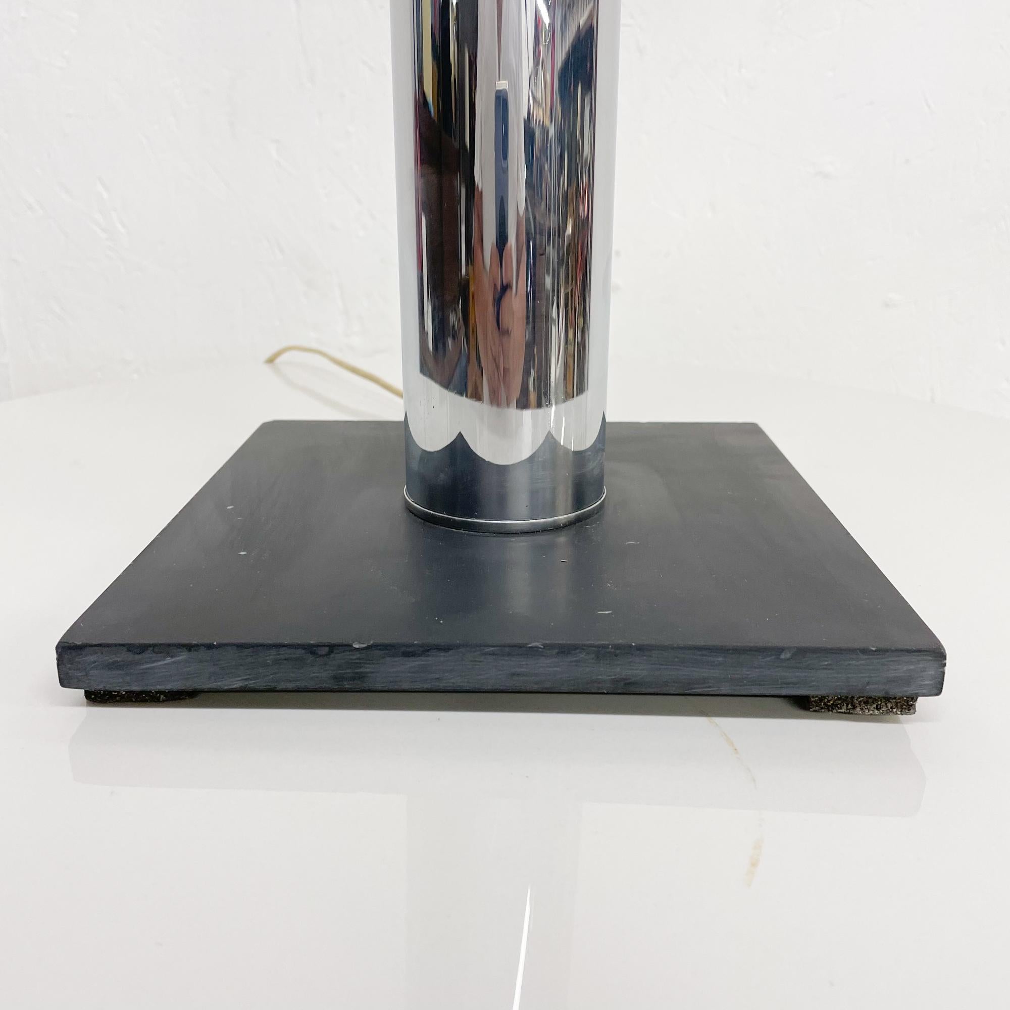 For your consideration: Walter Von Nessen New York Mid-Century Modern 1970s Bronx NY
Single table lamp chrome plated modern cylinder tower on black platform base.
Two socket lamp. No shade is included.
Measures: 33.5 H x 8 W x 8 D inches
Maker