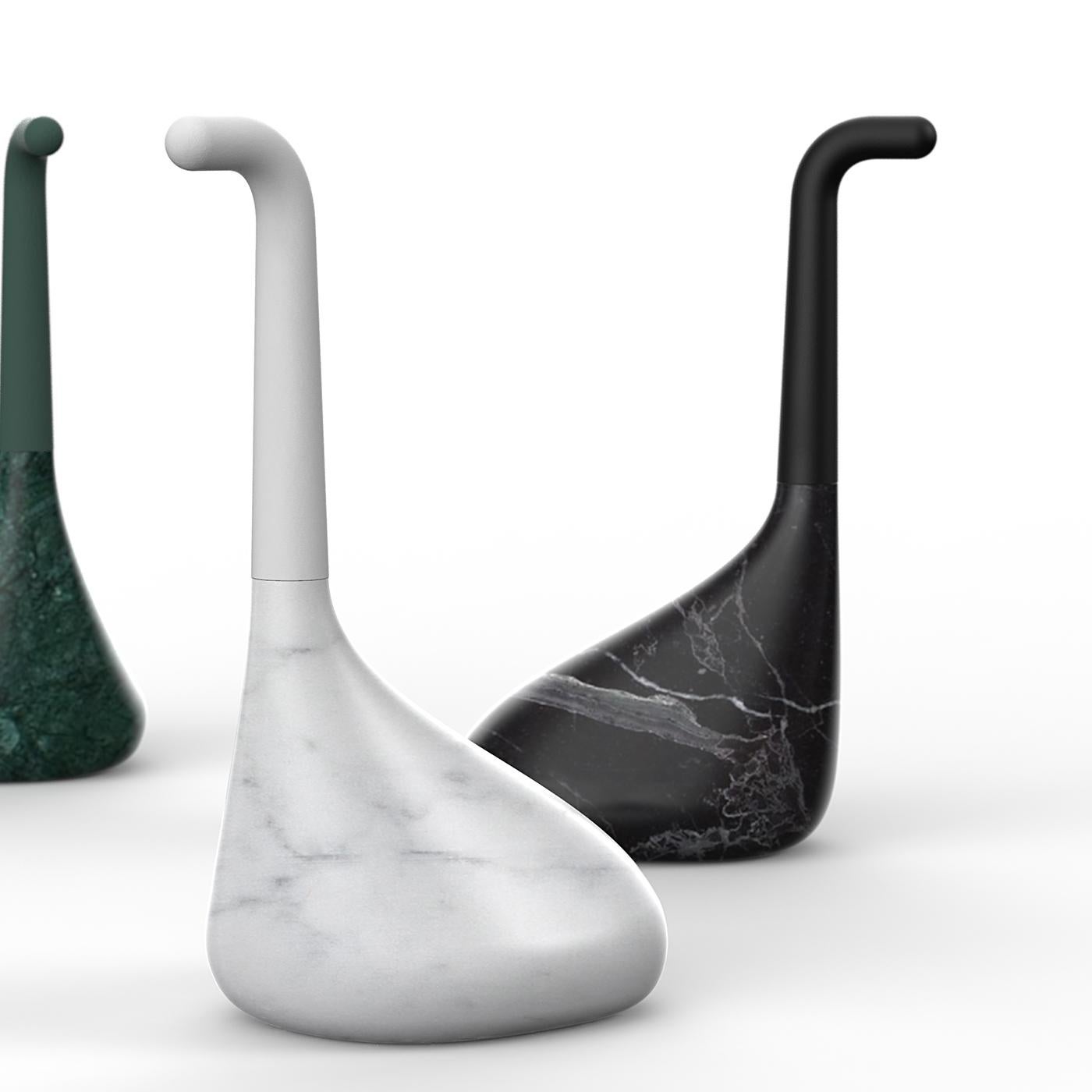 The Nessie Black Doorstop by Italian designer Luca Nichetto reproduces the iconic silhouette of the infamous Loch Ness Monster. Its solid marble base exudes a luxurious allure, defined by smooth lines and voluptuous curves. Boasting minimal