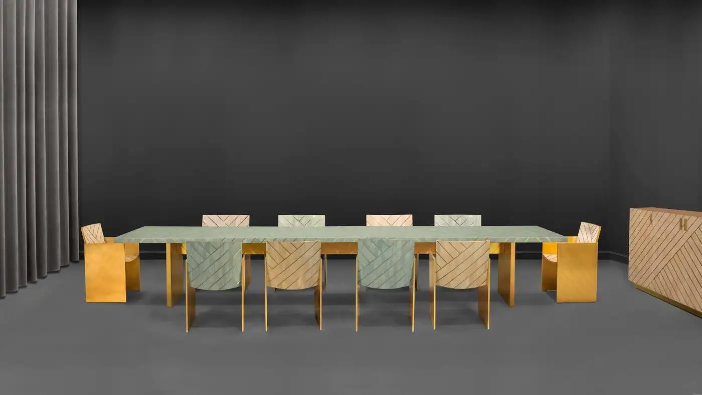 Nesso Small Dining Table with Brass Inlay by Matteo Cibic is luxurious in a pearly resin, brass inlay top and brass legs. It comes in three colors, beige, gray and mint. Custom sizes, colours and finishes are available on request.

Awarded designer
