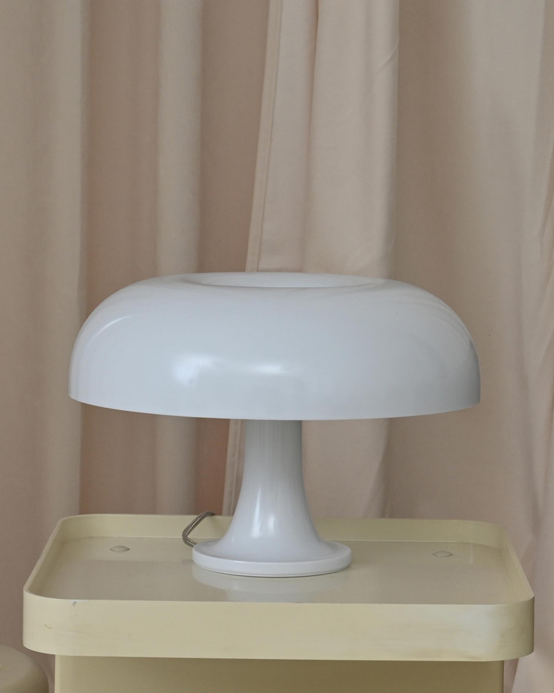 Designed by Giancarlo Mattioli for Artemide since the 1960s. This is a new-in-box recent production of the lamp. ABS plastic. Made in Italy. Comes with box, tag, and box literature. This lamp was inspired by nature. It is displayed in the Design