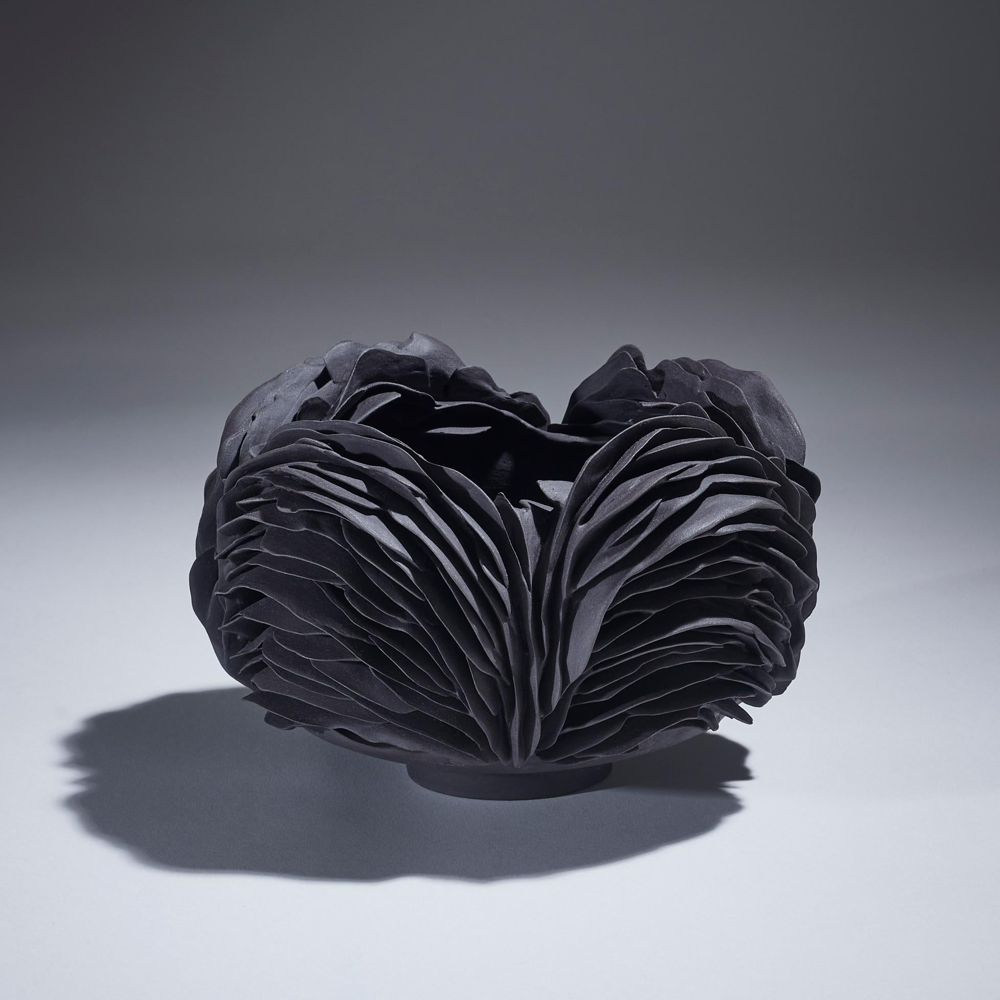 Nest II, 2022 (Porcelain, C. 4.3 in. H x 7 in. W x 7 in. D., Object No.: 3925)

Olivia Walker works in porcelain to create pieces that explore the symbiotic relationship between growth and decay, as well as the relationship between nature and