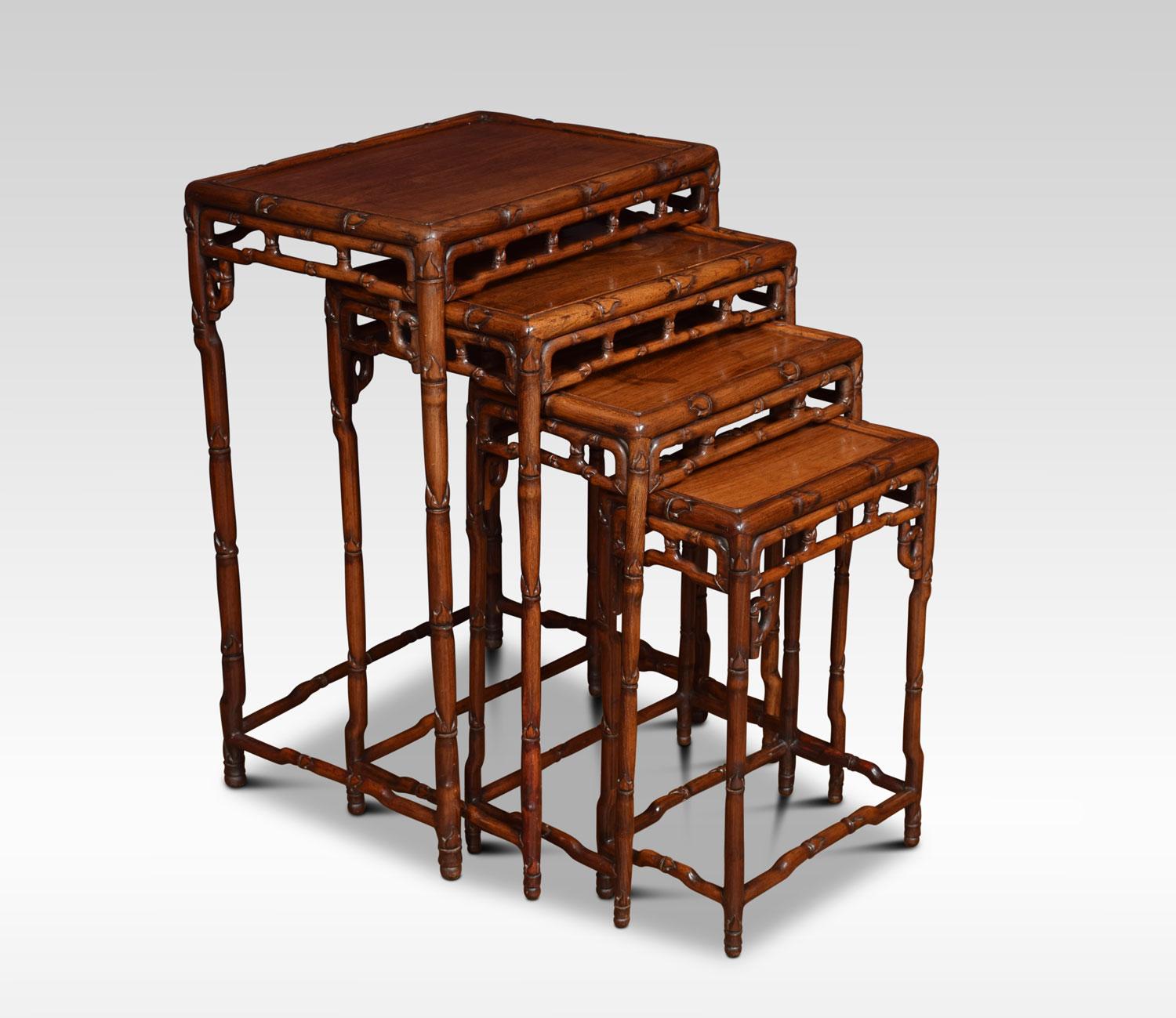 A nest of four rosewood tables having rectangular tops and pierced friezes. Raised up on faux bamboo legs with conforming stretchers.
Dimensions:
Height 29 inches
Width 20 inches
Depth 14.5 inches.