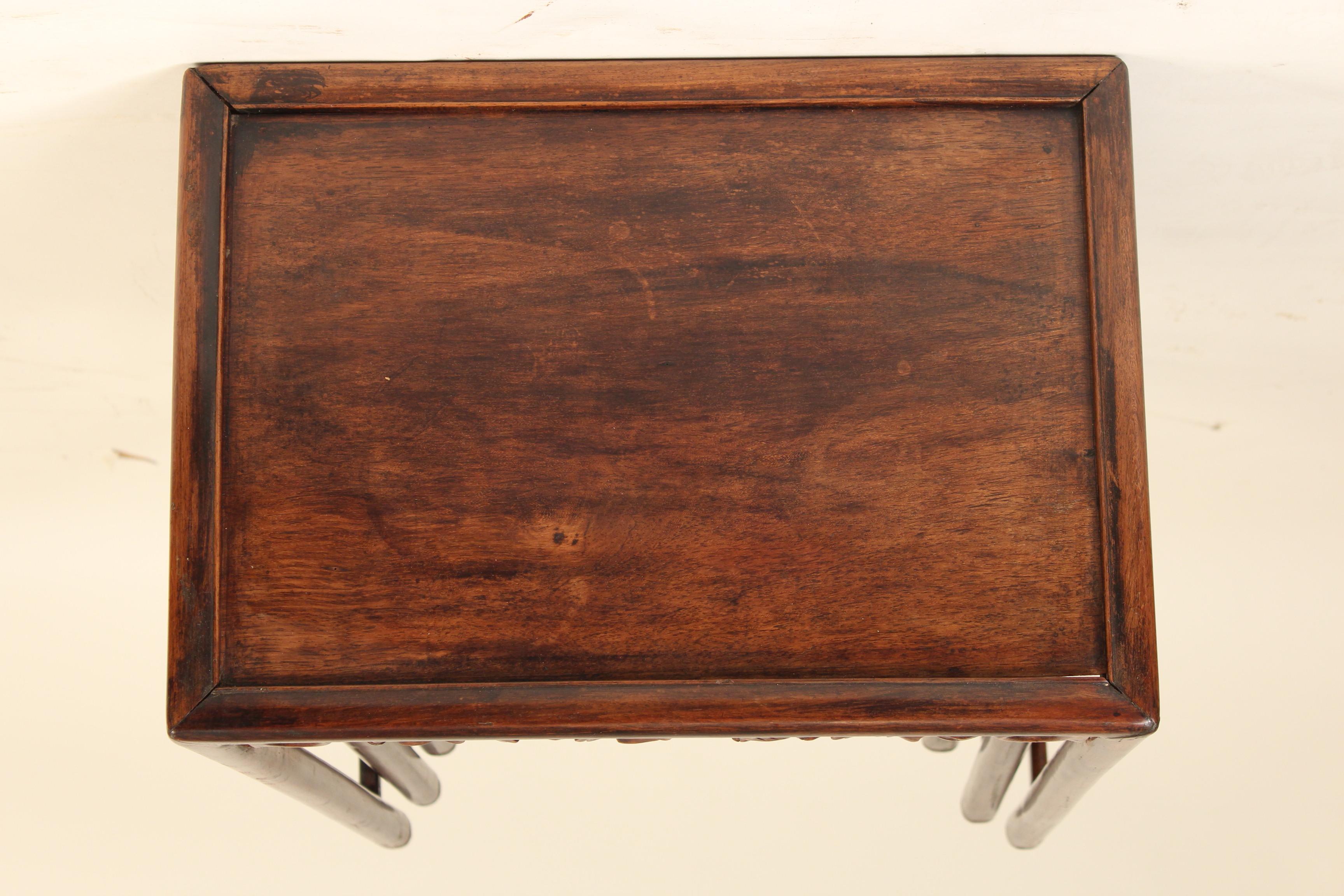 Mid-20th Century Nest of Four Chinese Teak Wood Tables