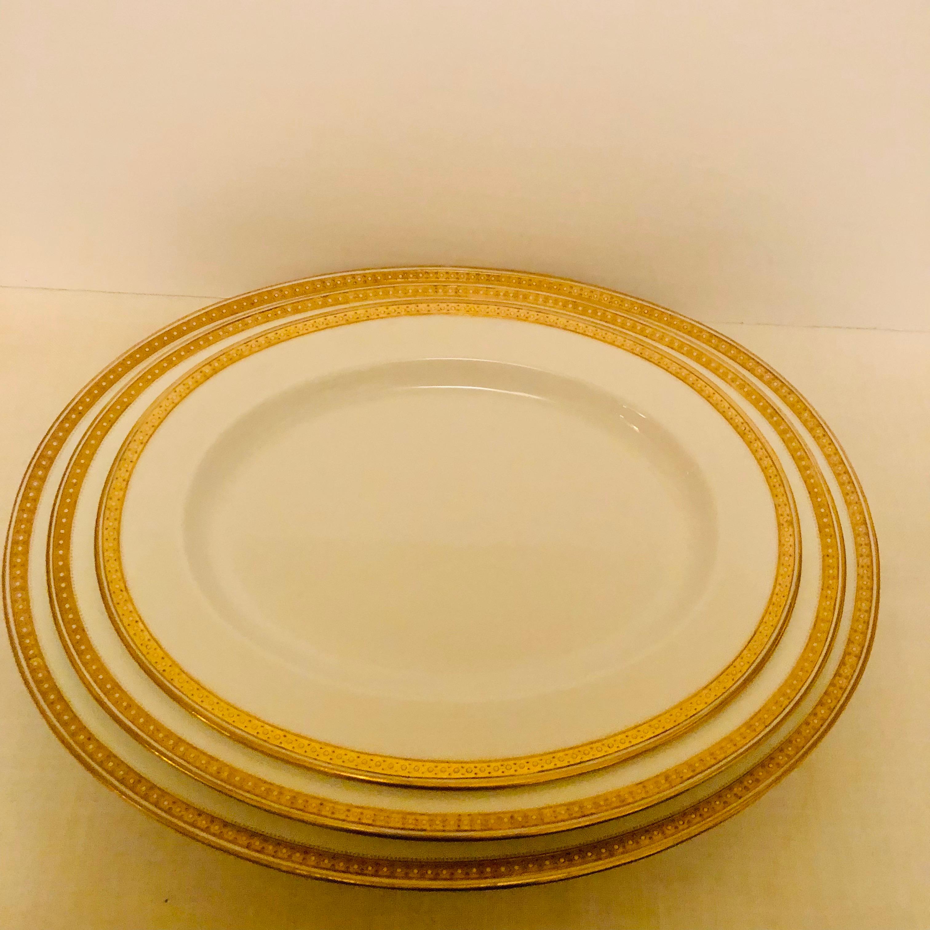 Nest of Four Spode Copeland Serving Platters With Gold Border and White Jeweling 6